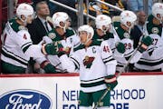 Minnesota Wild's Jared Spurgeon (46) returns to the bench after scoring during the second period of an NHL hockey game against the Pittsburgh Penguins