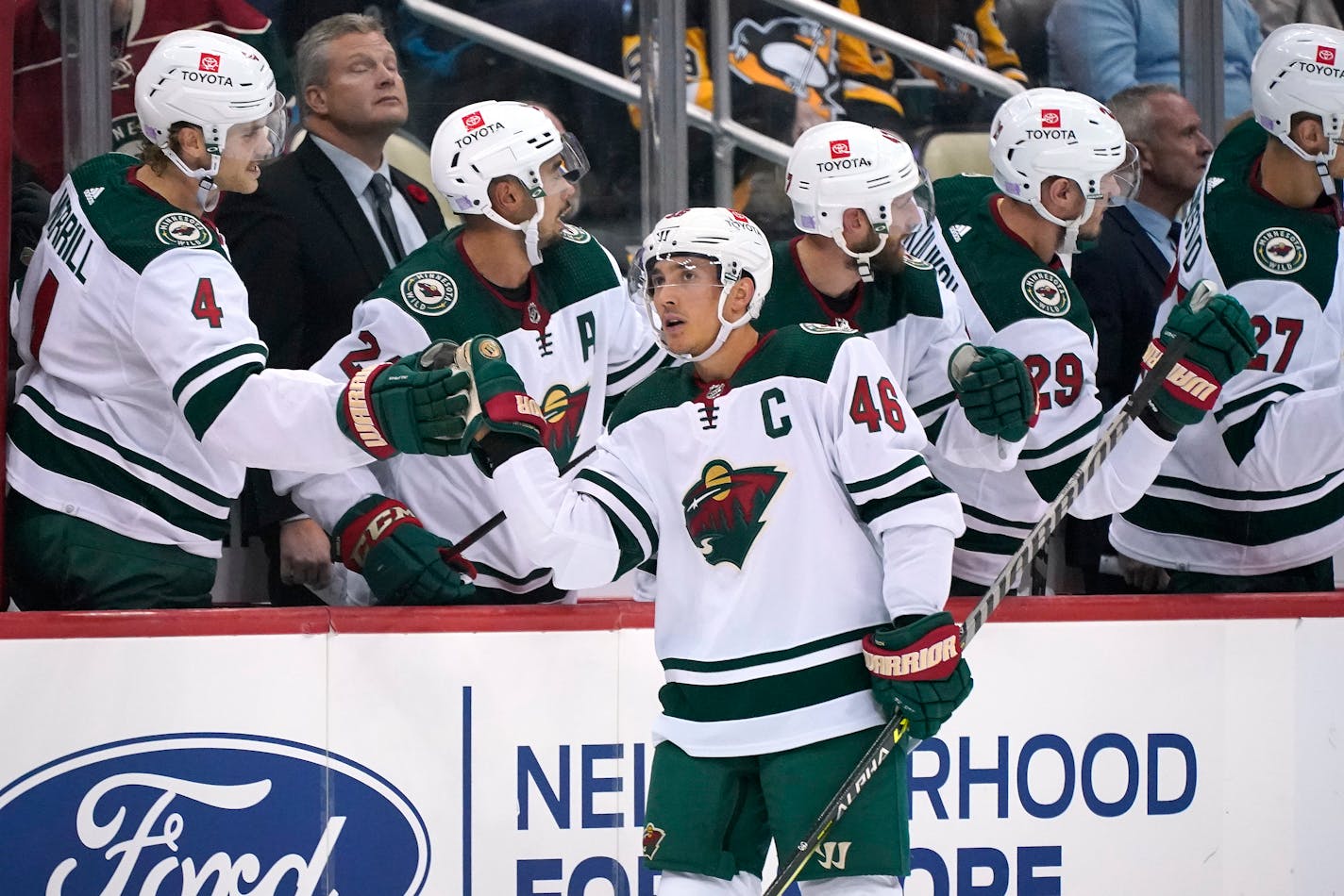 Minnesota Wild's Jared Spurgeon (46) returns to the bench after scoring during the second period of an NHL hockey game against the Pittsburgh Penguins in Pittsburgh, Saturday, Nov. 6, 2021. (AP Photo/Gene J. Puskar)