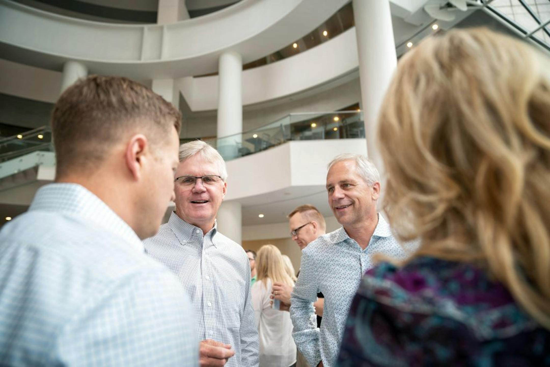 Karl McDonnell, right, CEO of combined Strayer-Capella, now called Strategic Education Inc. and Kevin Gilligan, left, CEO of Capella, met with employees in the atrium for ice cream to commemorate merger.