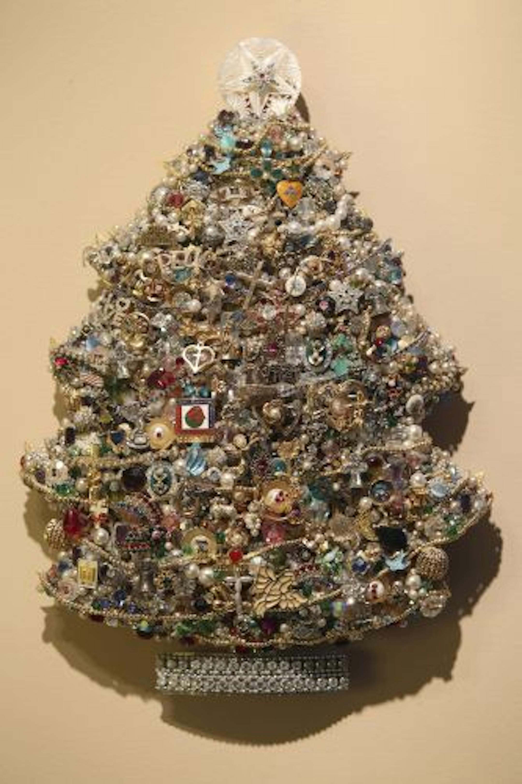 Marcille Groenke spent more than 20 years making this small tree that she hangs in her home. Many of the items are from old jewelry that has significance to her life.