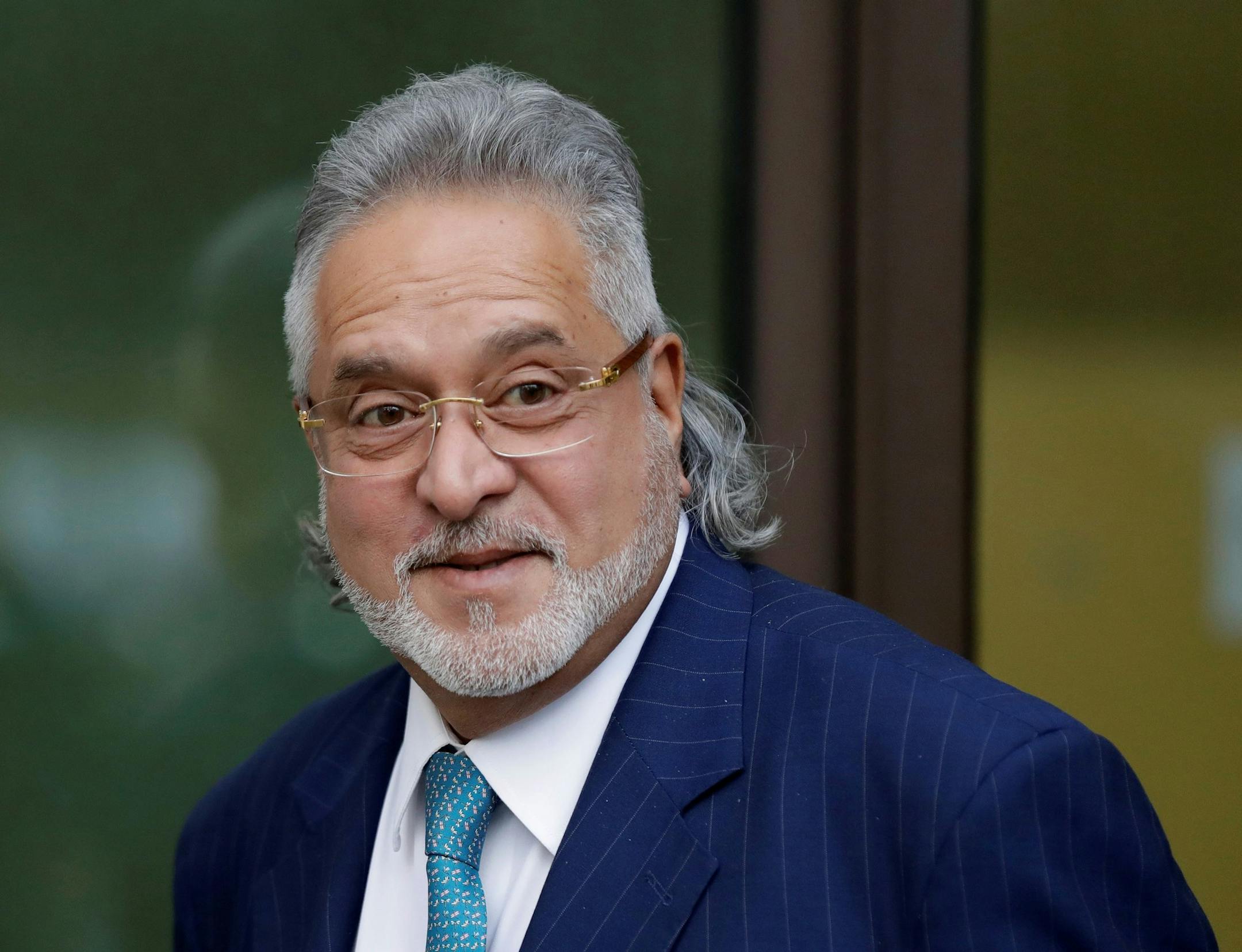 F1 Force India team boss Vijay Mallya leaves after a hearing for his extradition case at Westminster Magistrates Court, in London, Friday, March 16, 2018. Mallya, the United Breweries Group chairman and co-owner of the Force India F1 team, is wanted in India to face fraud allegations. He was arrested in April by the Metropolitan Police's extradition unit on behalf of authorities in India. (AP Photo/Matt Dunham) ORG XMIT: LMD110