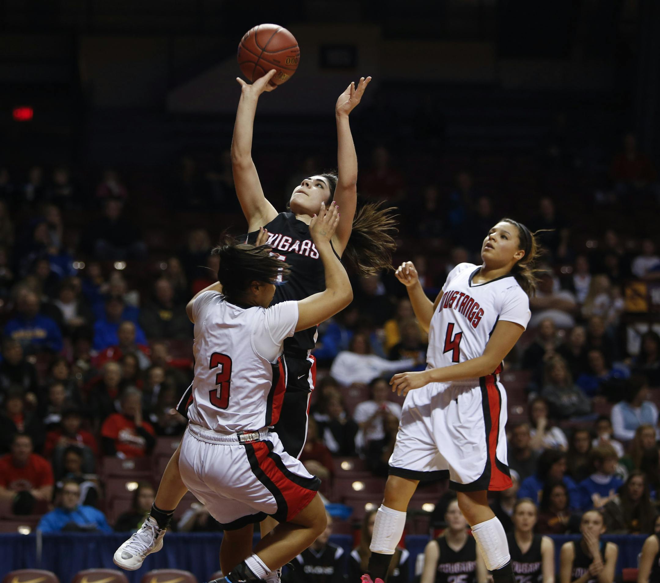 Ada-Borup's Monica Vega made the layup as Marantha's Olivia Austin was called for the foul during the second half during the Class A quarterfinals at Williams Arena in Minneapolis, Min., Thursday, March 14, 2013. Ada-Borup won 70-53 against Marantha Christian Academy. ] (KYNDELL HARKNESS/STAR TRIBUNE) kyndell.harkness@startribune.com
