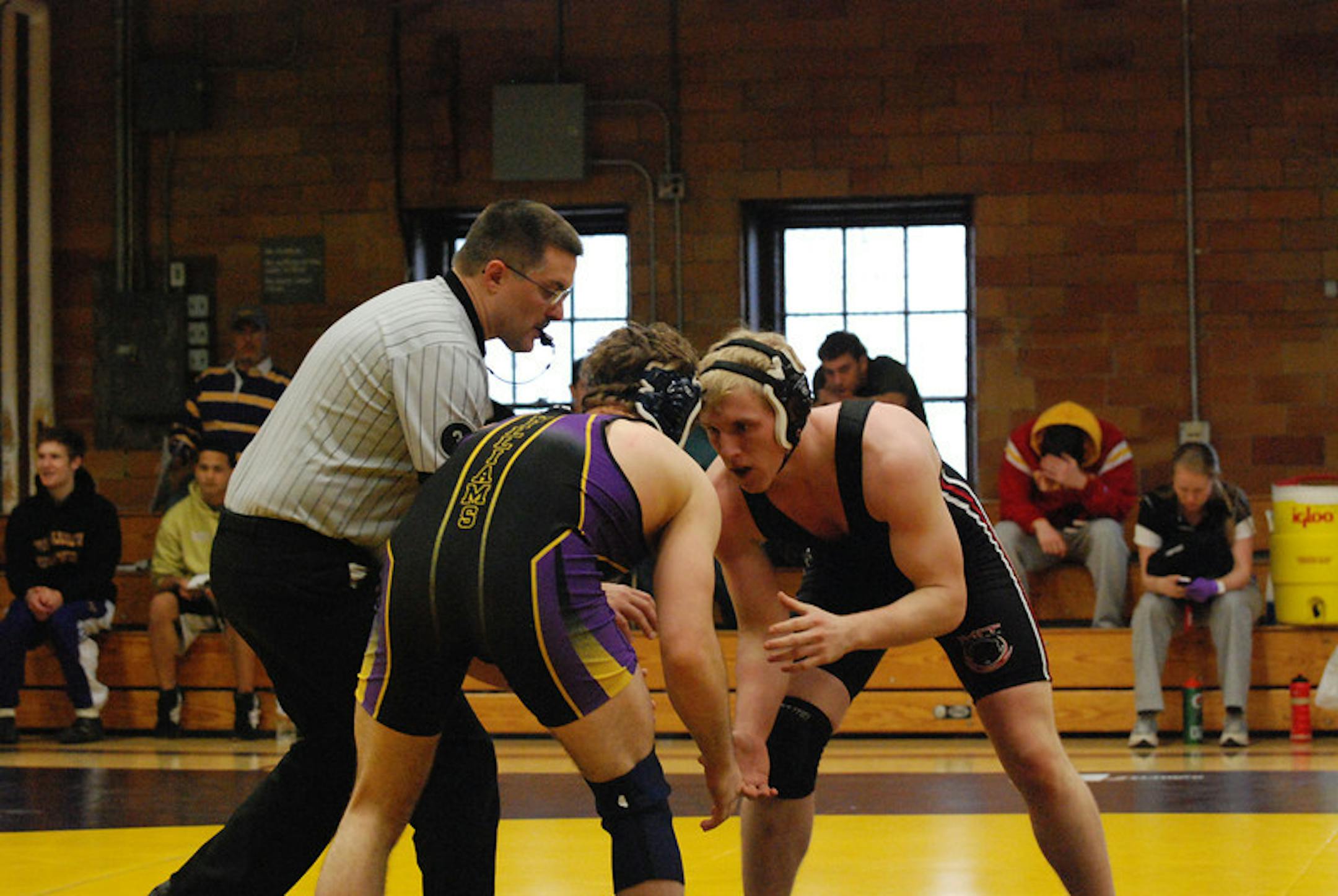 Brian Anderson, right, during a meet for the MIT club wrestling team.