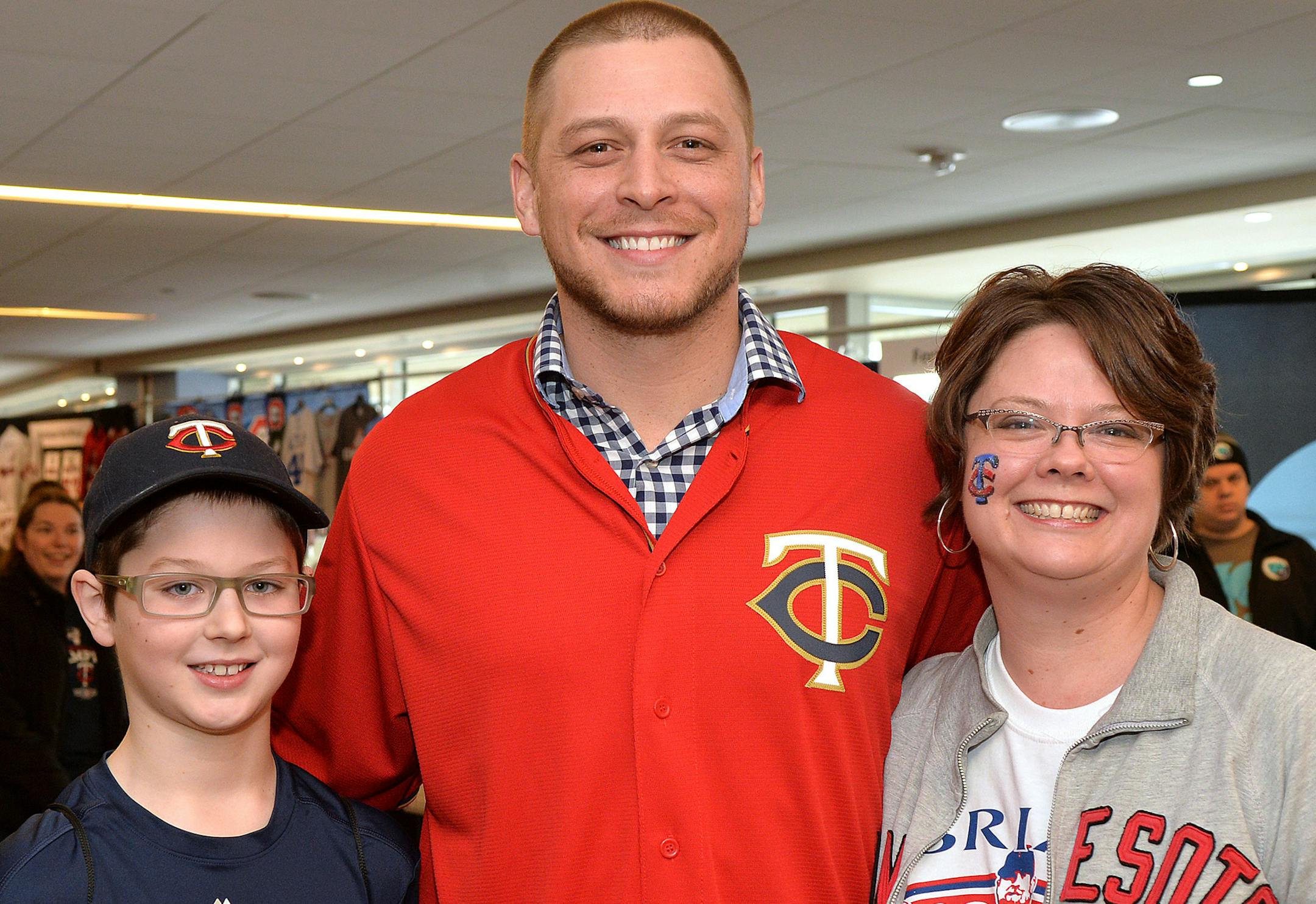 Outfielder Ryan Sweeney with Carl Moland-Kovash and his mother, Jenn.