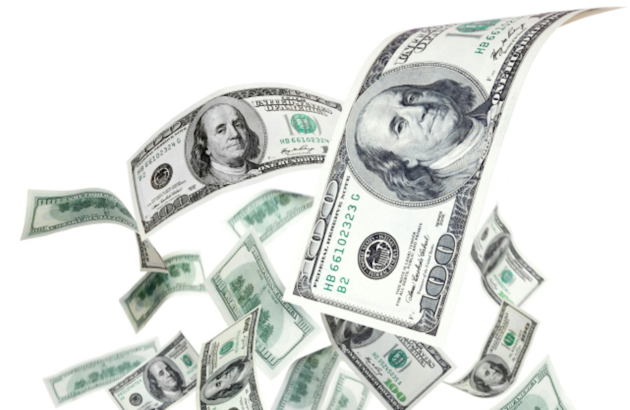 Falling dollars on a white background
