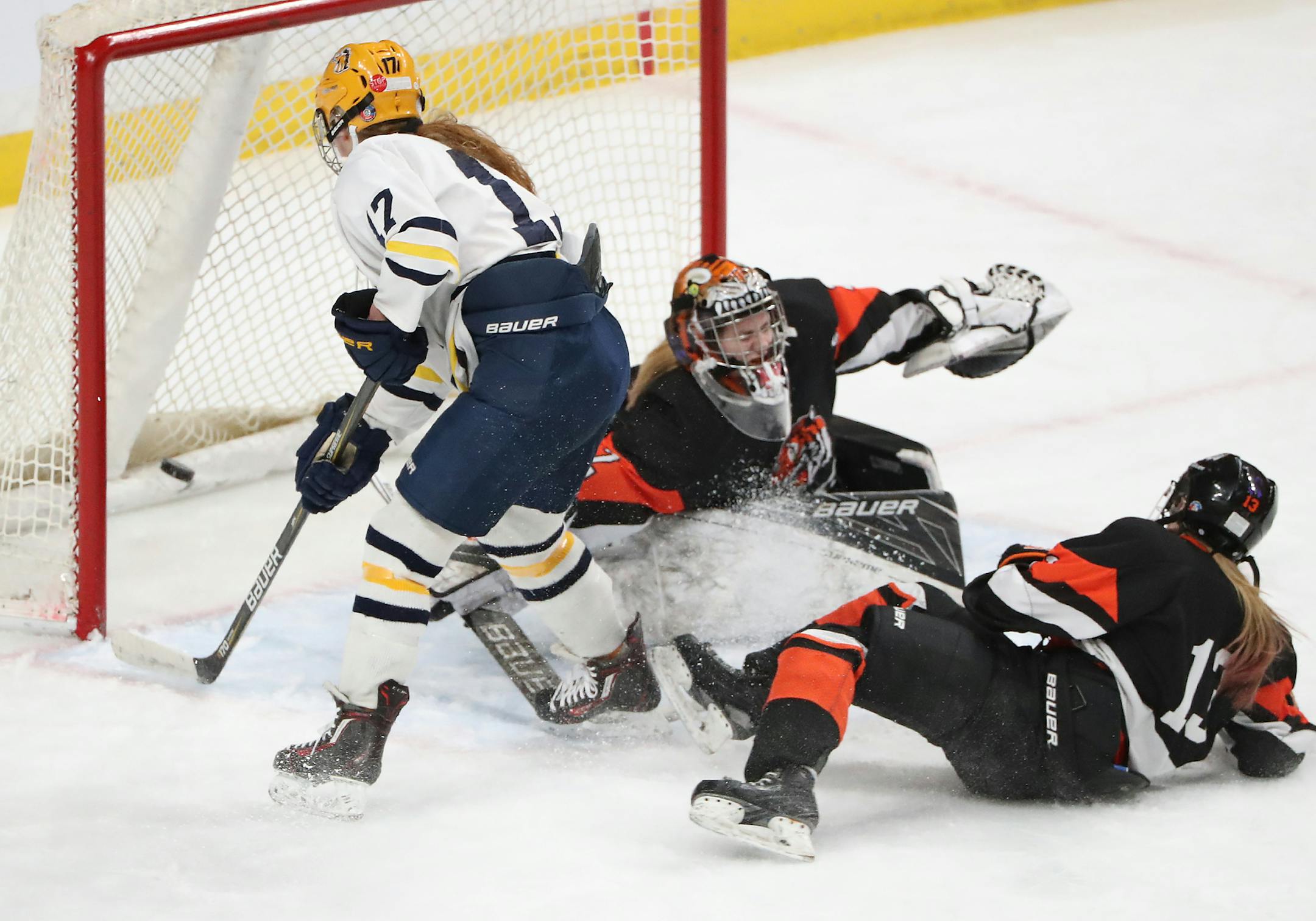 Breck's Olivia Mobley (17) scores on Marshall goalie Emma Klenken (2) during the first period of the Class 1A girls' hockey state tournament quarterfinals Wednesday, Feb. 21, 2018, at the Xcel Energy Center in St. Paul, MN. ] DAVID JOLES ï david.joles@startribune.com Class 1A girls' hockey state tournament quarterfinals
