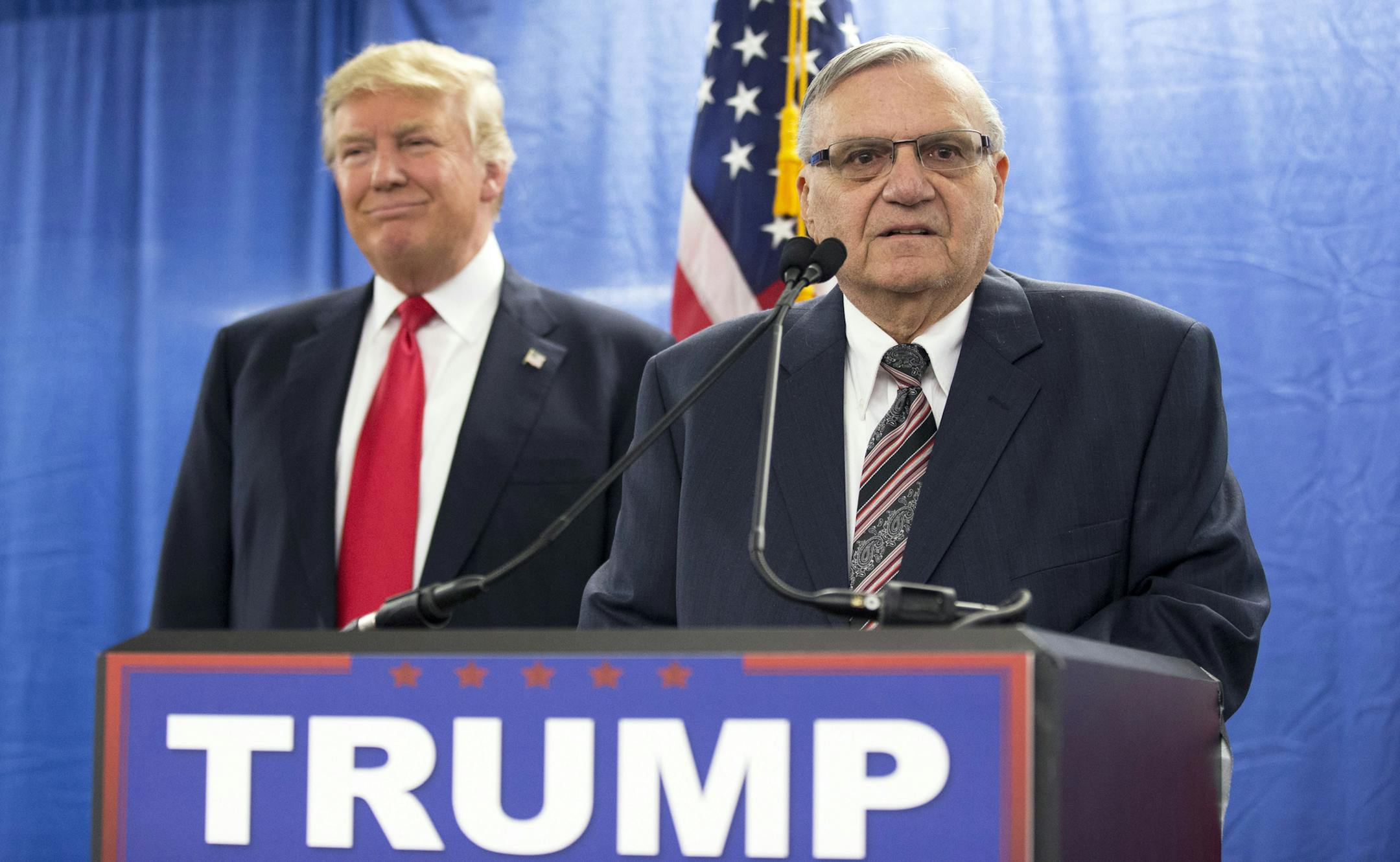 FILE - In this Jan. 26, 2016 file photo, Republican presidential candidate Donald Trump, left, is joined by Maricopa County, Ariz., Sheriff Joe Arpaio during a new conference in Marshalltown, Iowa. President Donald Trump has pardoned former sheriff Joe Arpaio following his conviction for intentionally disobeying a judge's order in an immigration case. The White House announced the move Friday night, Aug. 25, 2017, saying the 85-year-old ex-sheriff of Arizona's Maricopa County was a "worthy candi