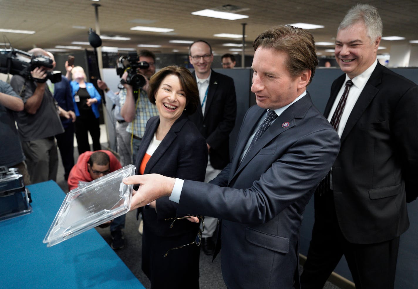 Minnesota Senator Amy Klobuchar and Representative Dean Phillips took a tour of SkyWater Technology in Bloomington with CEO Tom Sonderman (right) Tuesday morning. The visit was used to discuss U.S. manufacturing competitiveness and supply constraints in chip manufacturing.