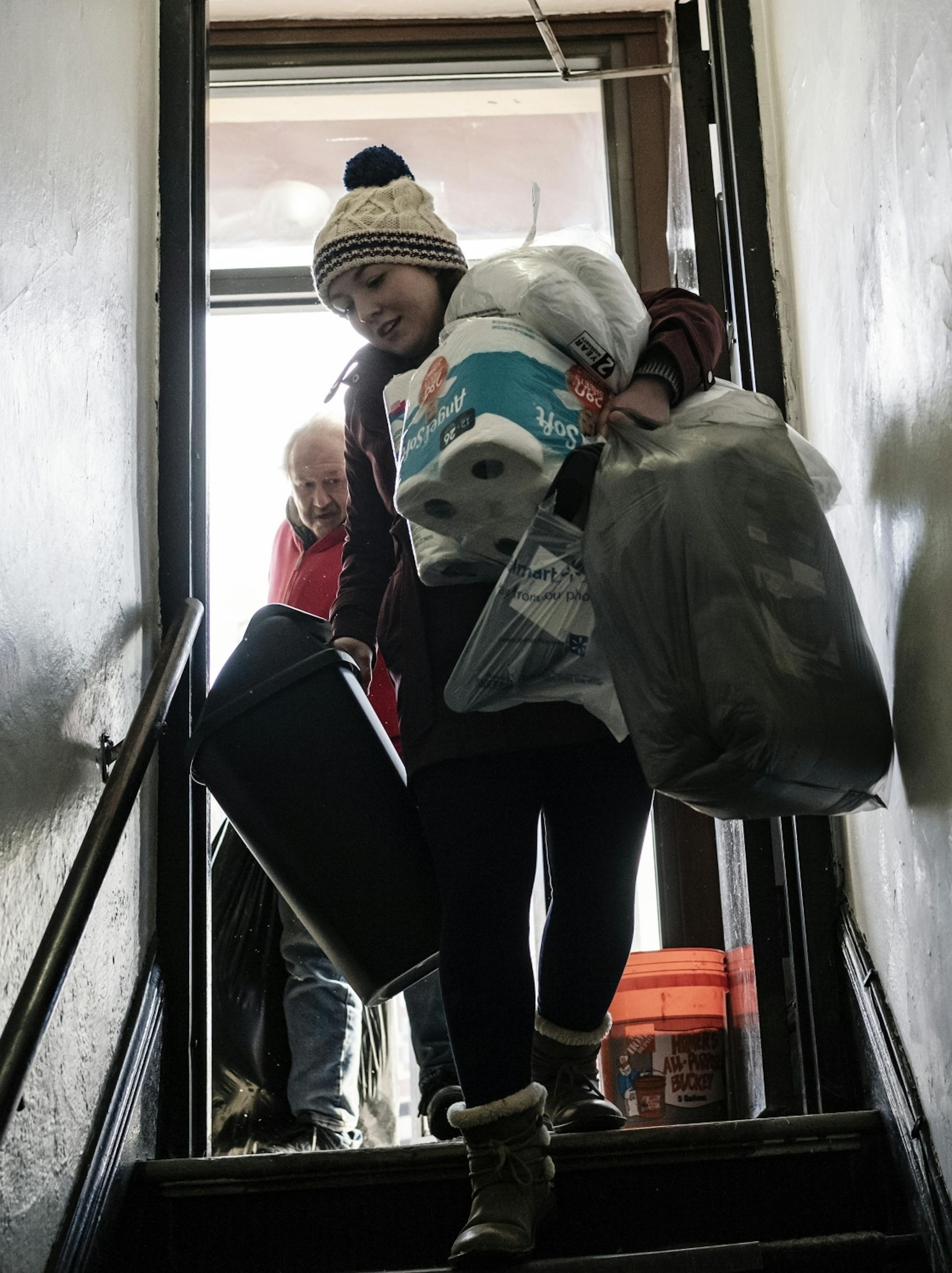 Housing Coordinator Genevieve Pelrine of Start Today Hennepin helps Robert Kleen move to his studio in downtown Minneapolis.