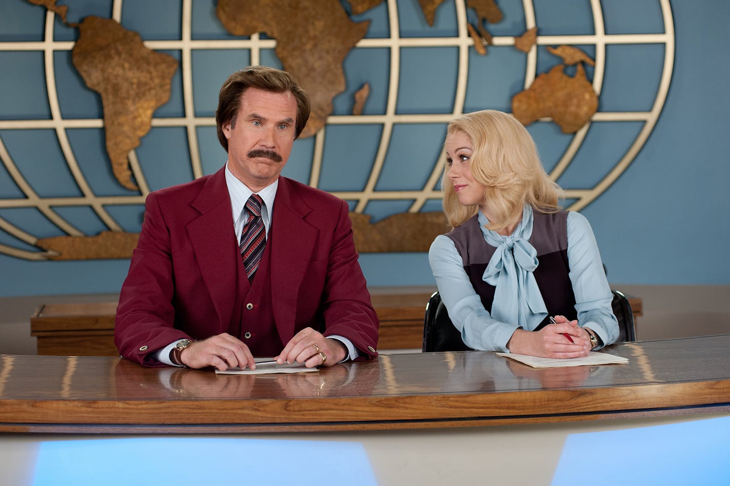 This image released by Paramount Pictures shows Will Ferrell as Ron Burgundy, left, and Christina Applegate as Veronica Corningstone in a scene from "Anchorman 2: The Legend Continues." (AP Photo/Paramount Pictures, Gemma LaMana) ORG XMIT: MIN2013121814102350 ORG XMIT: MIN1312181413141473