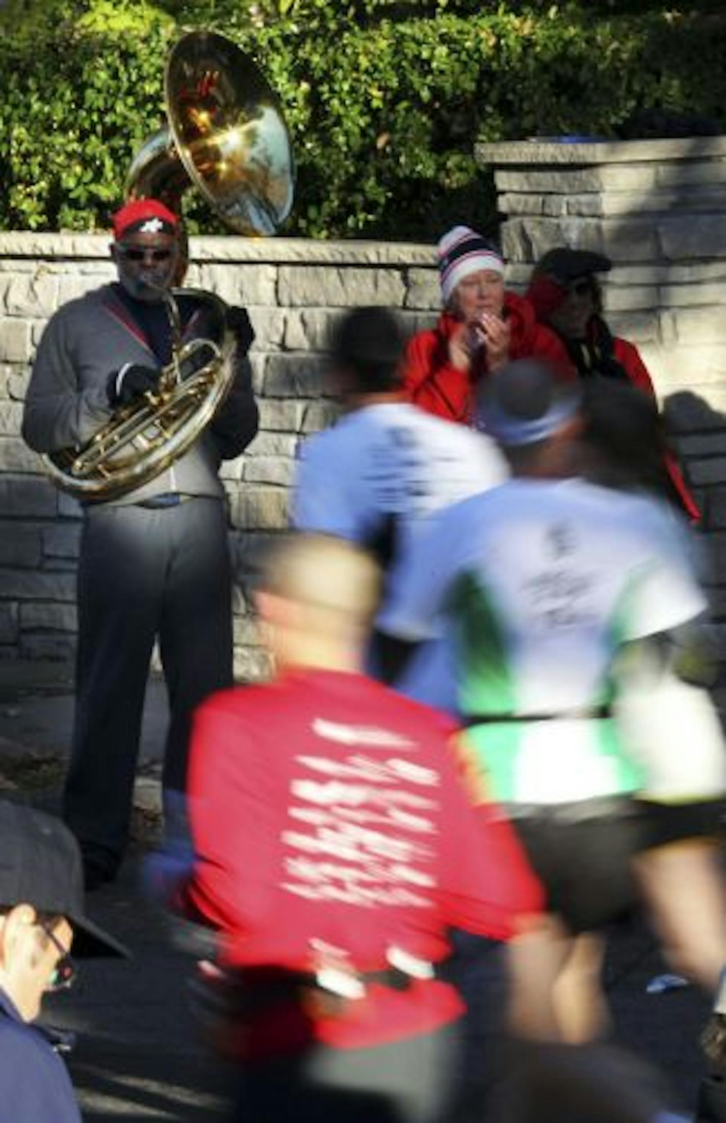 Minnesota Supreme Court Justice and former Vikings great Alan Page played "Whistle While You Work" and other sousaphone hits again this year at the Twin Cities Marathon.