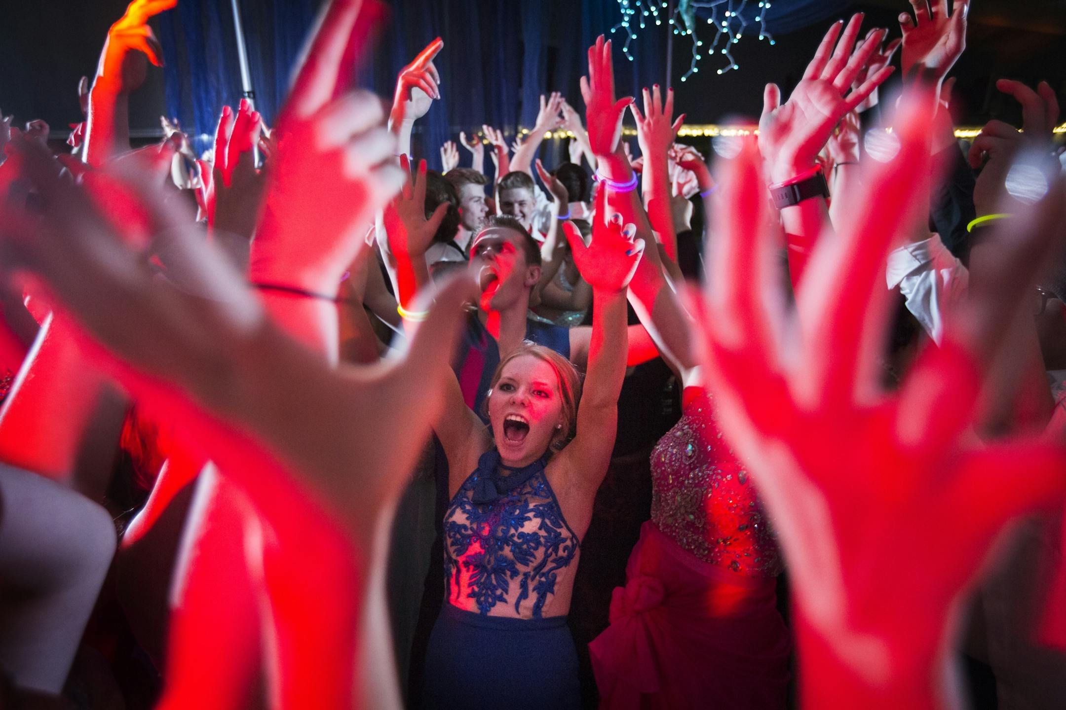 Senior Sydney Patrow, center, dances at the Eveleth-Gilbert High School prom.