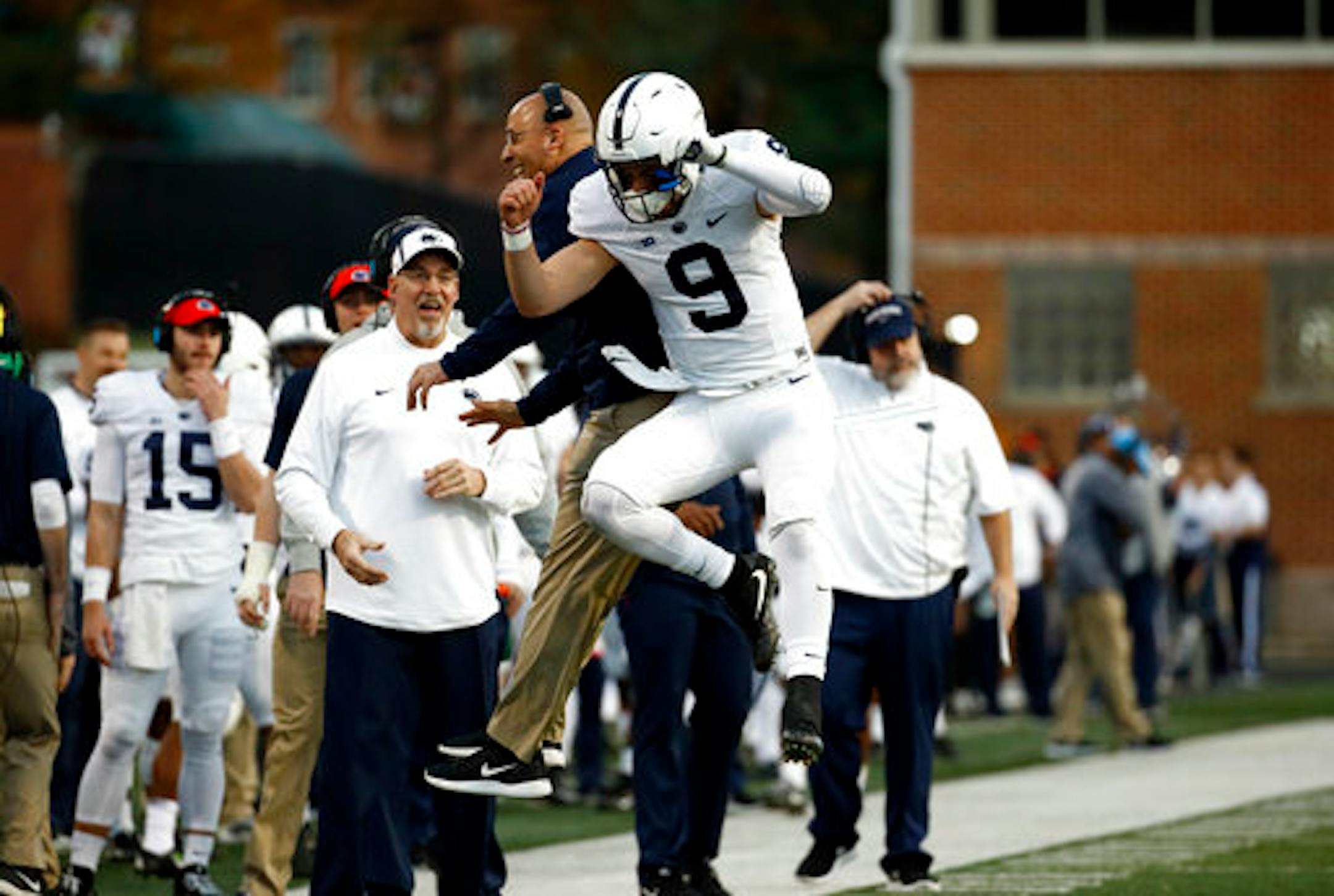 Penn State head coach James Franklin, left, and quarterback Trace McSorley celebrate after McSorley threw for a touchdown in the first half of an NCAA college football game against Maryland in College Park, Md., Saturday, Nov. 25, 2017. (AP Photo/Patrick Semansky)