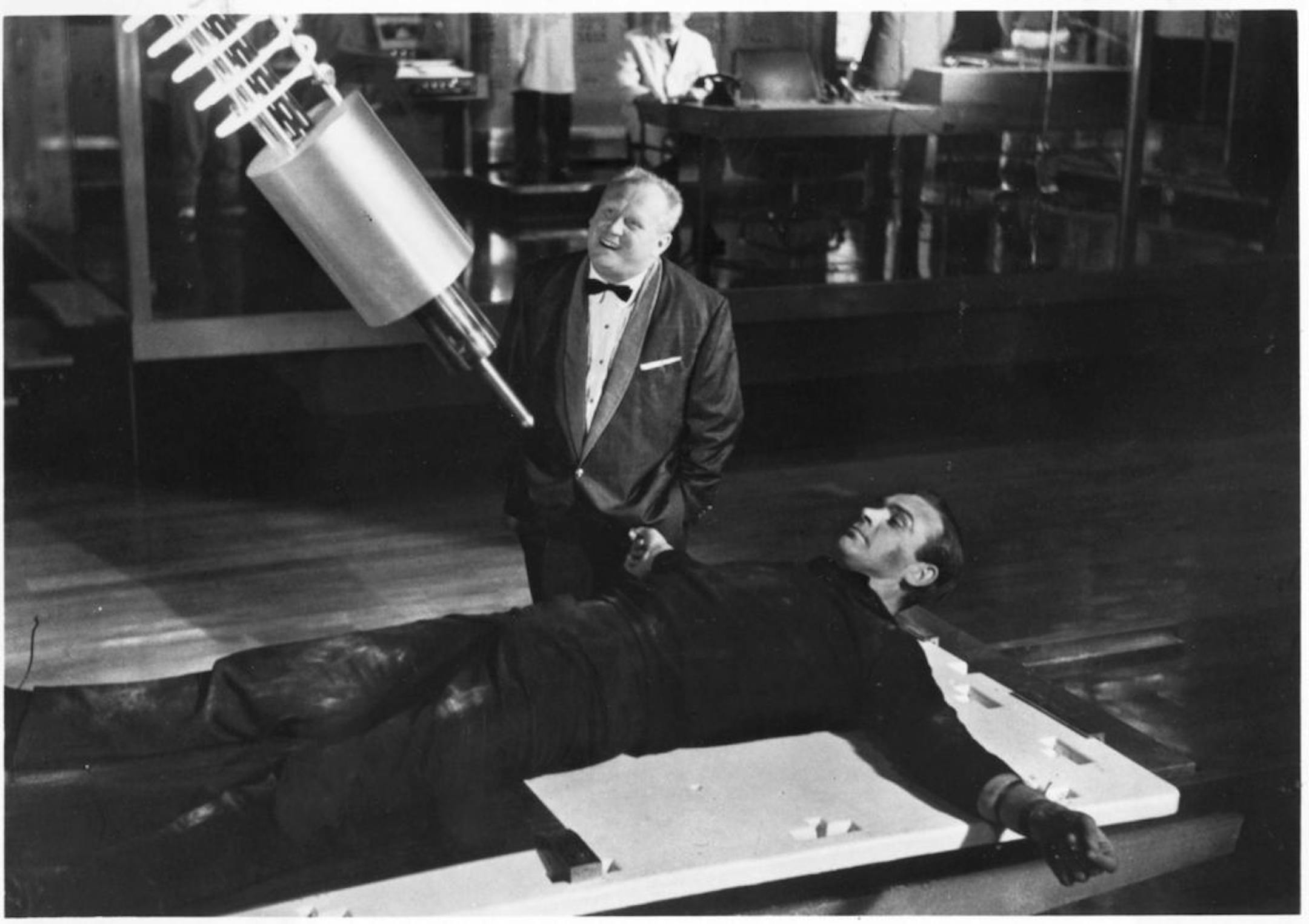 Gert Frobe, left, and Sean Connery, in a scene from the movie "Goldfinger."