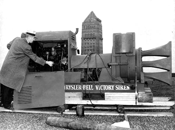 Howard O. Kelly of Minneapolis’ Civilian Defense Council inspects the 5,500-pound siren atop the Northwestern National Bank in 1943. This siren prec