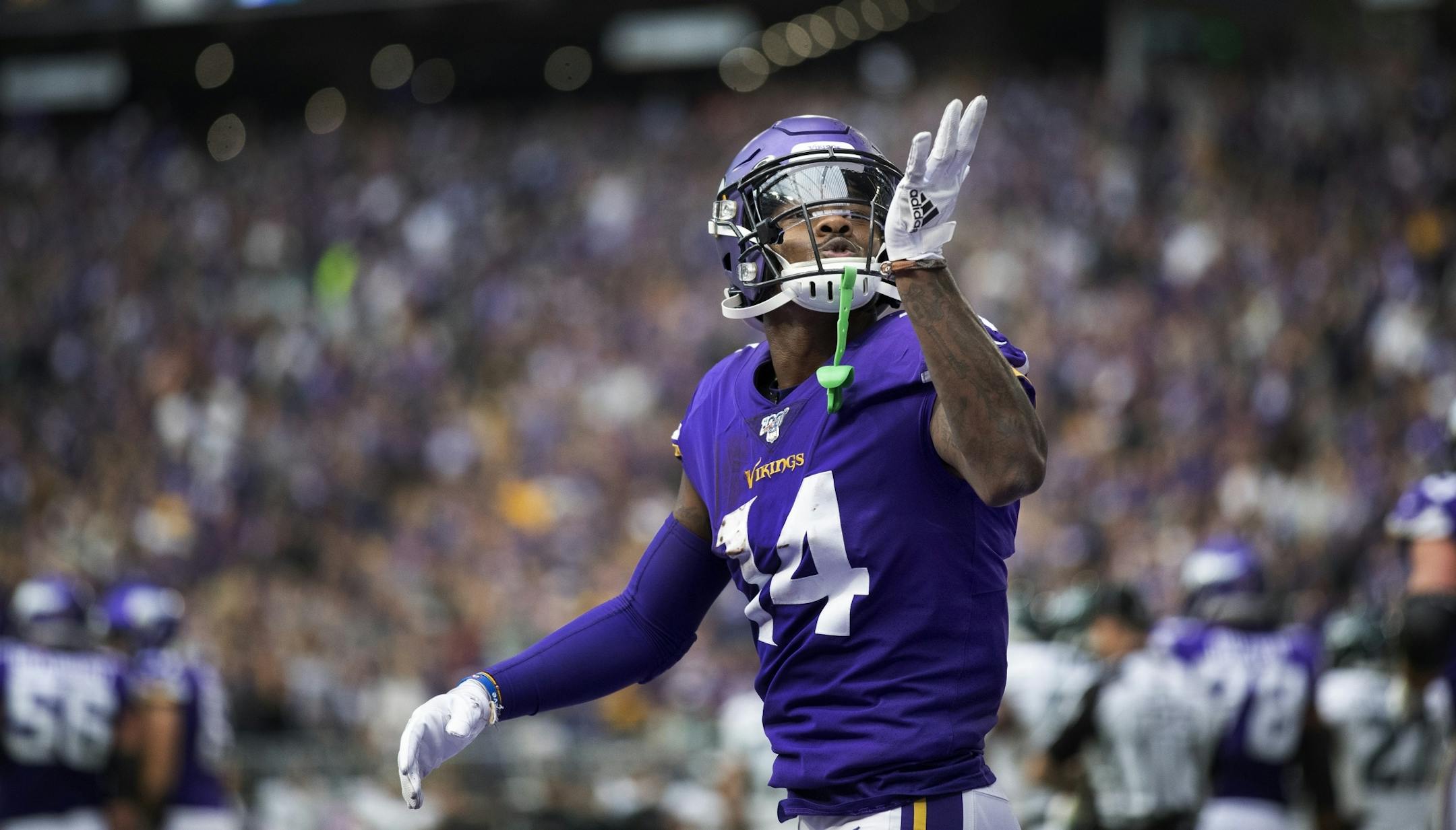Minnesota Vikings wide receiver Stefon Diggs (14) blew a kiss to the fans after catching his third catch of the game at U.S. Bank Stadium.