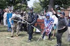 FILE -- Far right demonstrators during the "Unite the Right" event in Charlottesville, Va., Aug. 12, 2017. Attorney General Jeff Sessions said on Mond