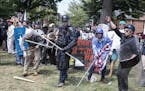 FILE -- Far right demonstrators during the "Unite the Right" event in Charlottesville, Va., Aug. 12, 2017. Attorney General Jeff Sessions said on Mond