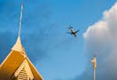 A plane flew over the Lake Harriet Band Shell in an area of Minneapolis increasingly affected by jet noise.