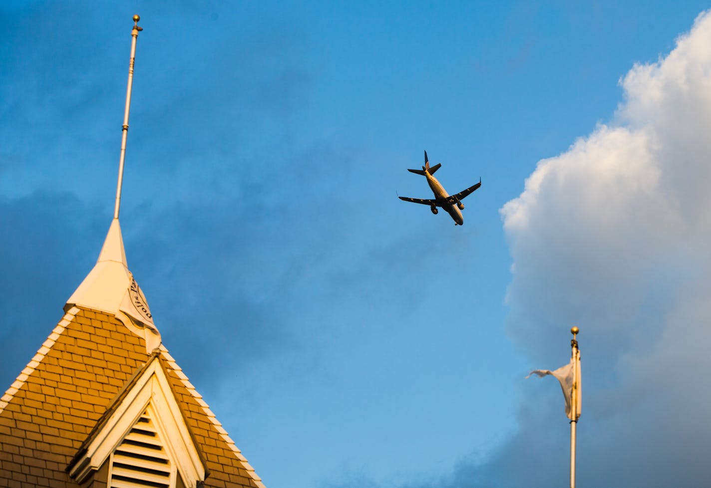 A plane flew over the Lake Harriet Band Shell in an area of Minneapolis increasingly affected by jet noise.