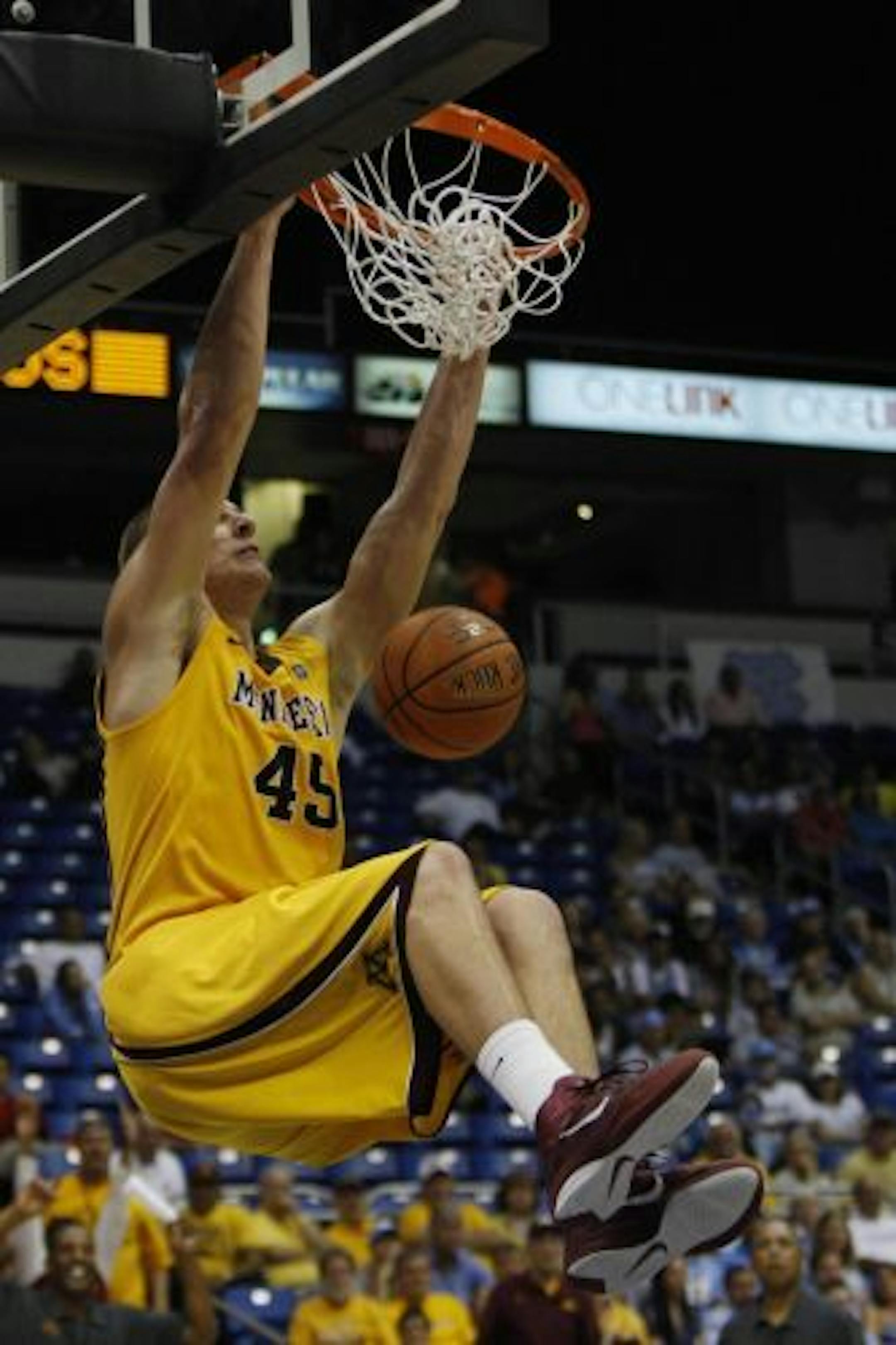 Minnesota's Colton Iverson dunks the ball against North Carolina.