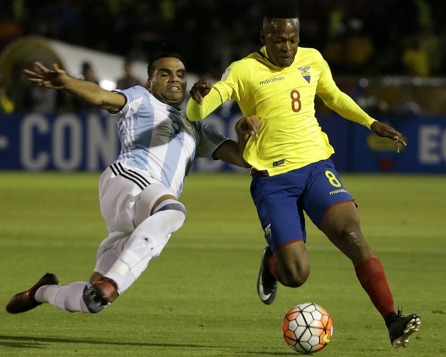 Ecuador's Romario Ibarra, right, fights for the ball against Argentina's Gabriel Mercado during their 2018 World Cup qualifying soccer match at the Atahualpa Olympic Stadium in Quito, Ecuador, Tuesday, Oct. 10, 2017. (AP Photo/Fernando Vergara) ORG XMIT: MXDL122