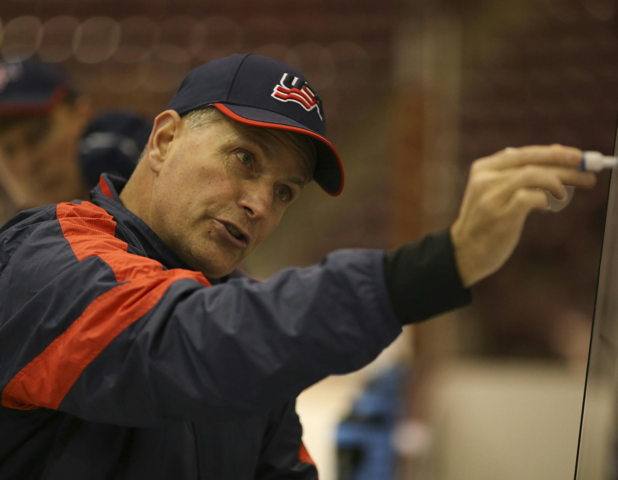 Don Lucia diagrammed a play in his role as head coach of the U.S. team as it practiced at Mariucci Arena earlier this month in preparations for the World Junior Championship in Malmo, Sweden.