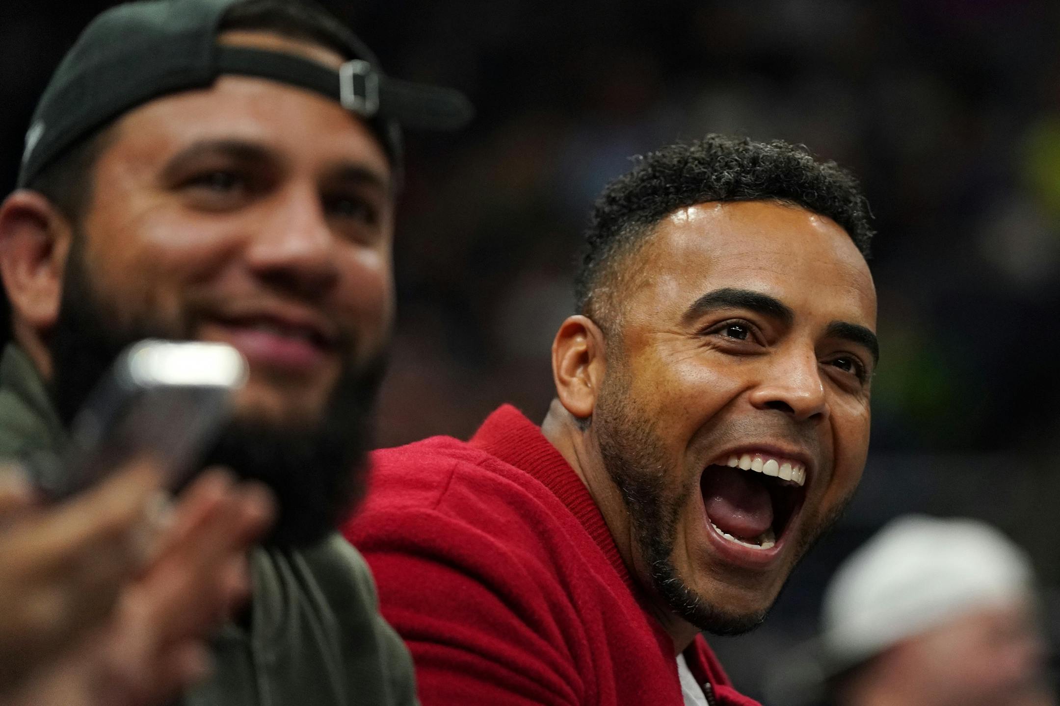 Minnesota Twins designated hitter Nelson Cruz cheered on the Minnesota Timberwolves from the sidelines in the first half.