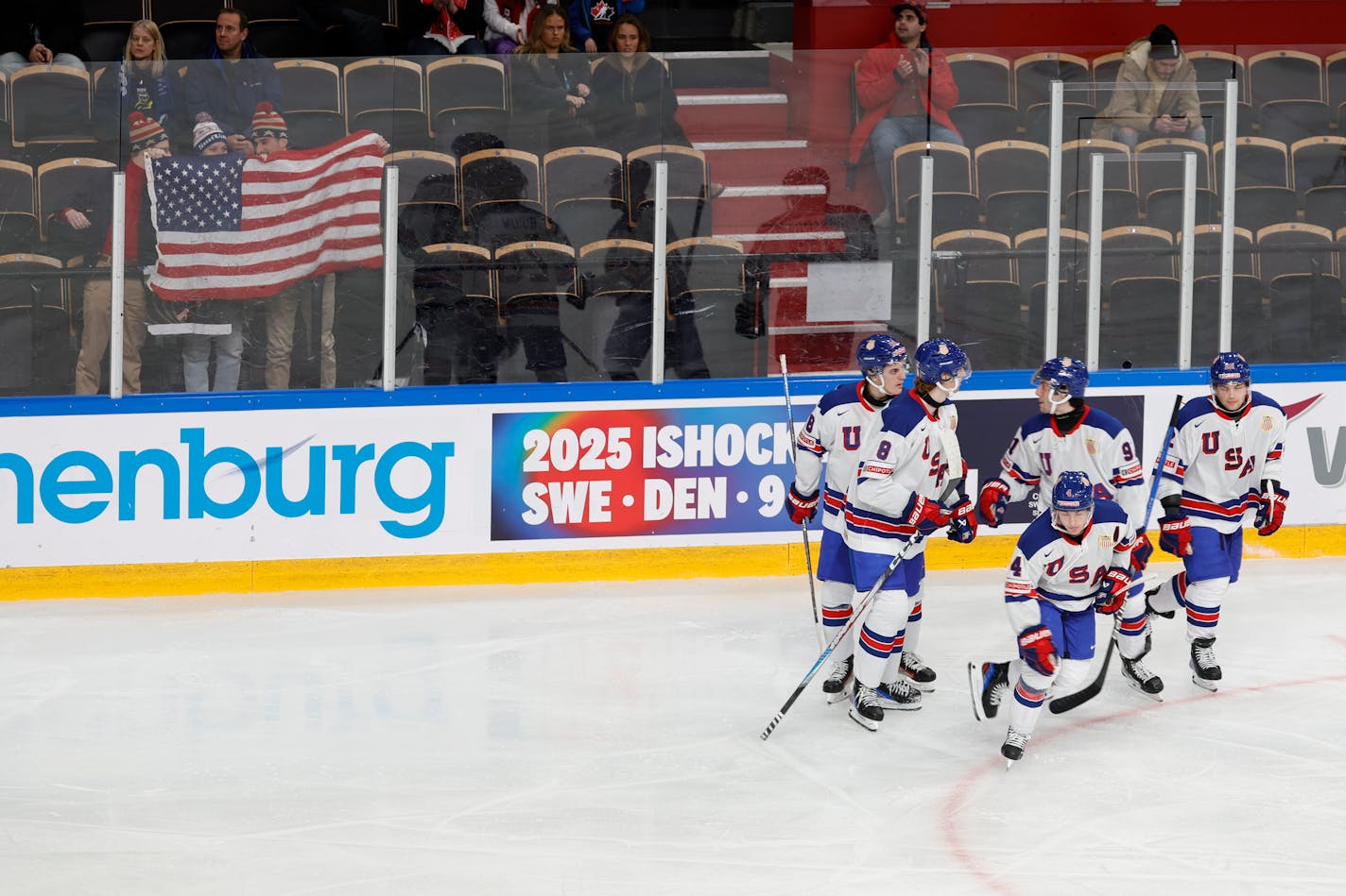 USA's Gavin Brindley celebrates scoring with teammates during the group B ice hockey match between Switzerland and USA at the IIHF World Junior Hockey Championship in Gothenburg, Sweden on Thursday, Dec. 28, 2023. (Adam Ihse/TT via AP)