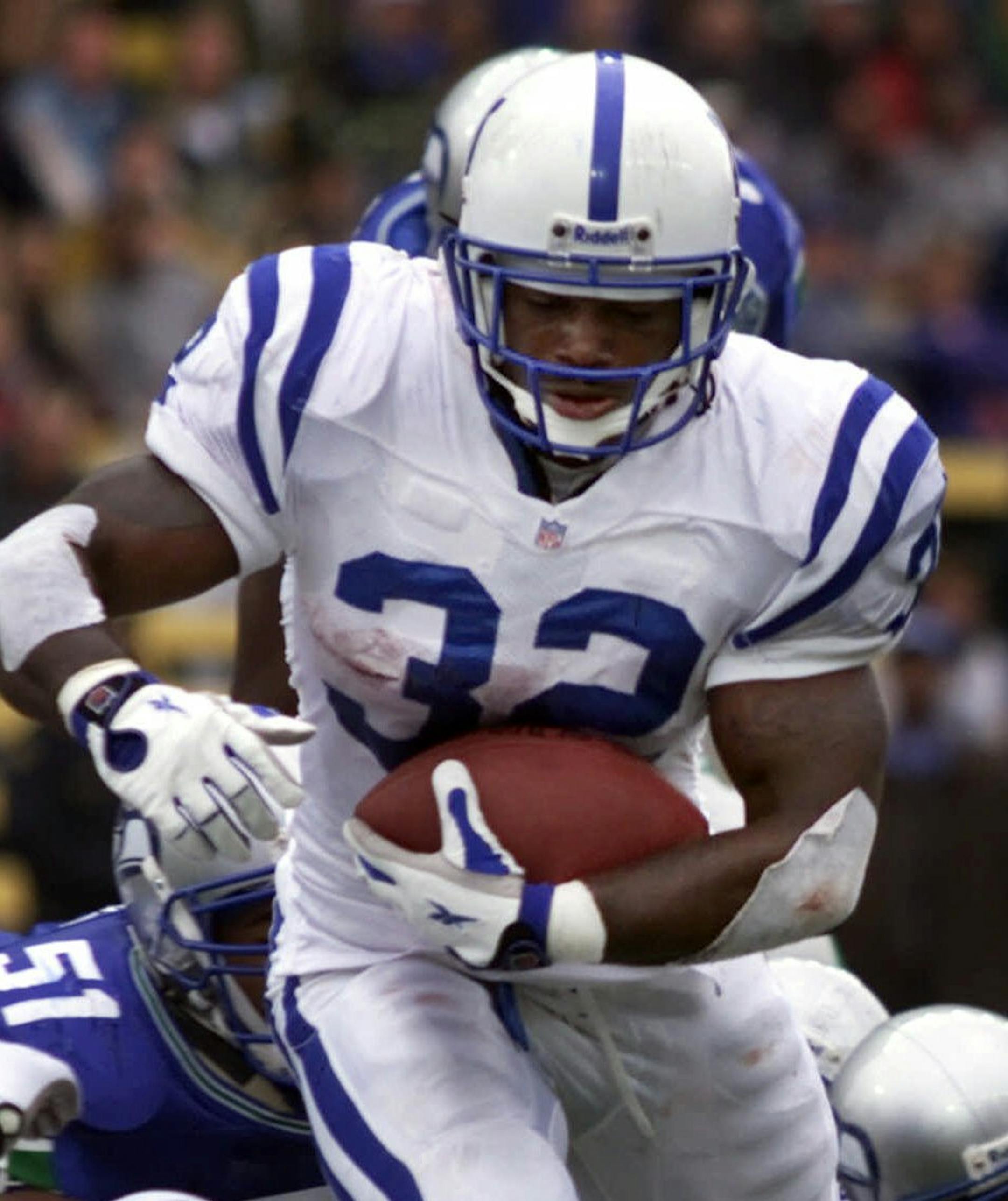 Indianapolis Colts' Edgerrin James runs into the end zone to score during the third quarter as Seattle Seahawks defenders Anthony Simmons (51) and Jay Bellamy watch from behind Sunday, Oct. 15, 2000 in Seattle. Edgerrin rushed for 219 yards in the 37-24 win for the Colts. (AP Photo/John Froschauer) ORG XMIT: SEA105