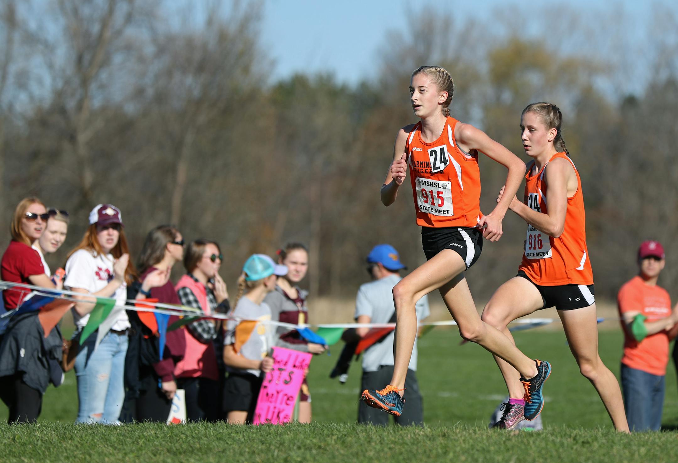Eighth grader Anna Fenske (915) and sophomore Lauren Peterson (916) enter the second 1600 meters neck and neck in the 2A girls state high school cross country meet at St. Olaf College on Saturday, November 5, 2016. Fenske pulled away and won the race.] SHARI L. GROSS ï sgross@startribune.com St. Olaf College, Northfield, Minn. Saturday, November 5, 2016