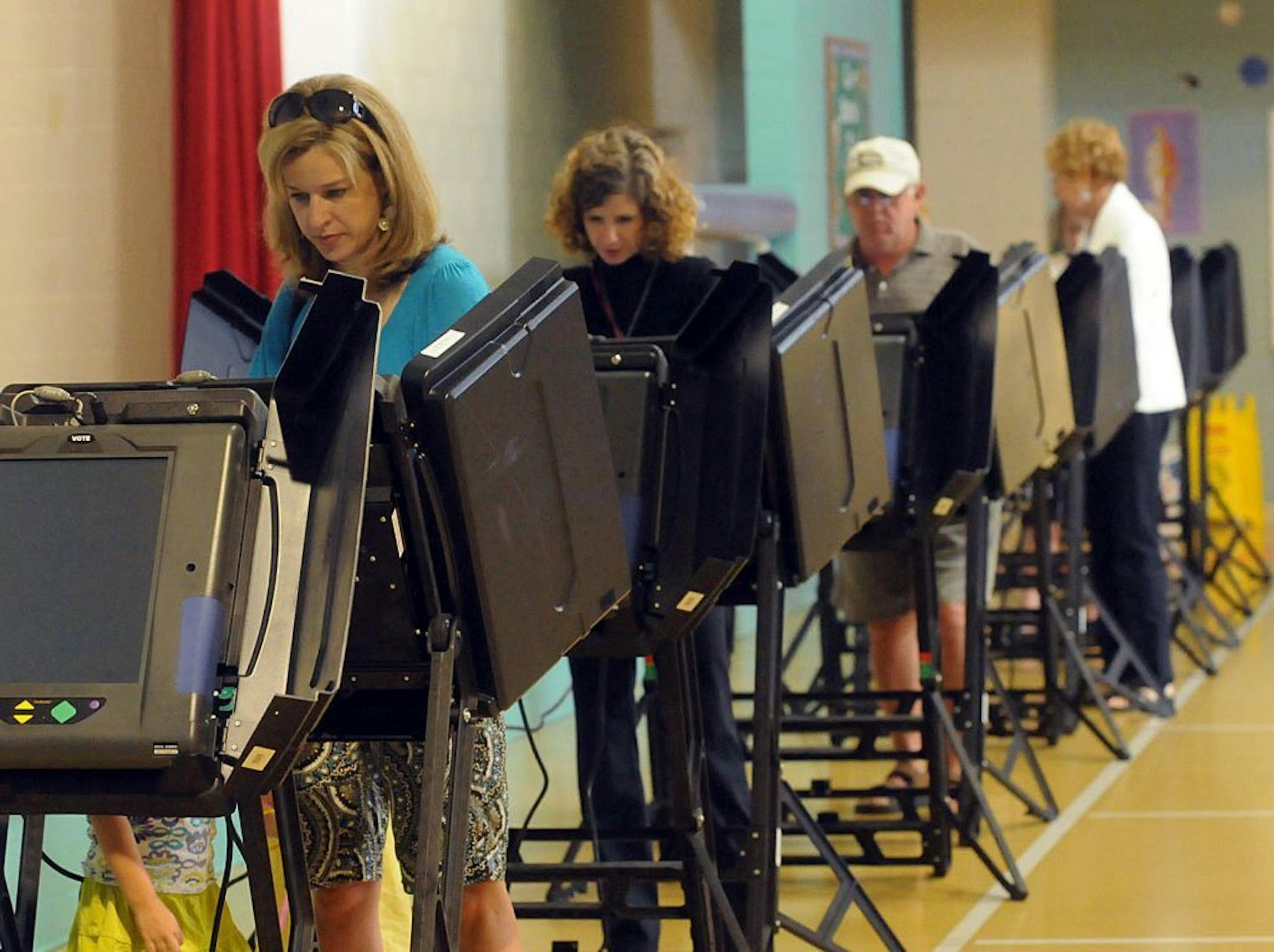 Gretchen Colby casts her vote Tuesday, May 8, 2012, at Belville Elementary School in Brunswick County, N.C. North Carolina could be the next state to pass a constitutional amendment defining marriage as solely between a man and a woman. Voters are casting their ballots Tuesday.