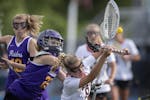 Brooke Lewis of Eden Prairie (8) and goalkeeper Kaelie Smith of Cretin-Derham Hall collide during the game Tuesday June 11, 2019 in Minnetonka, MN.