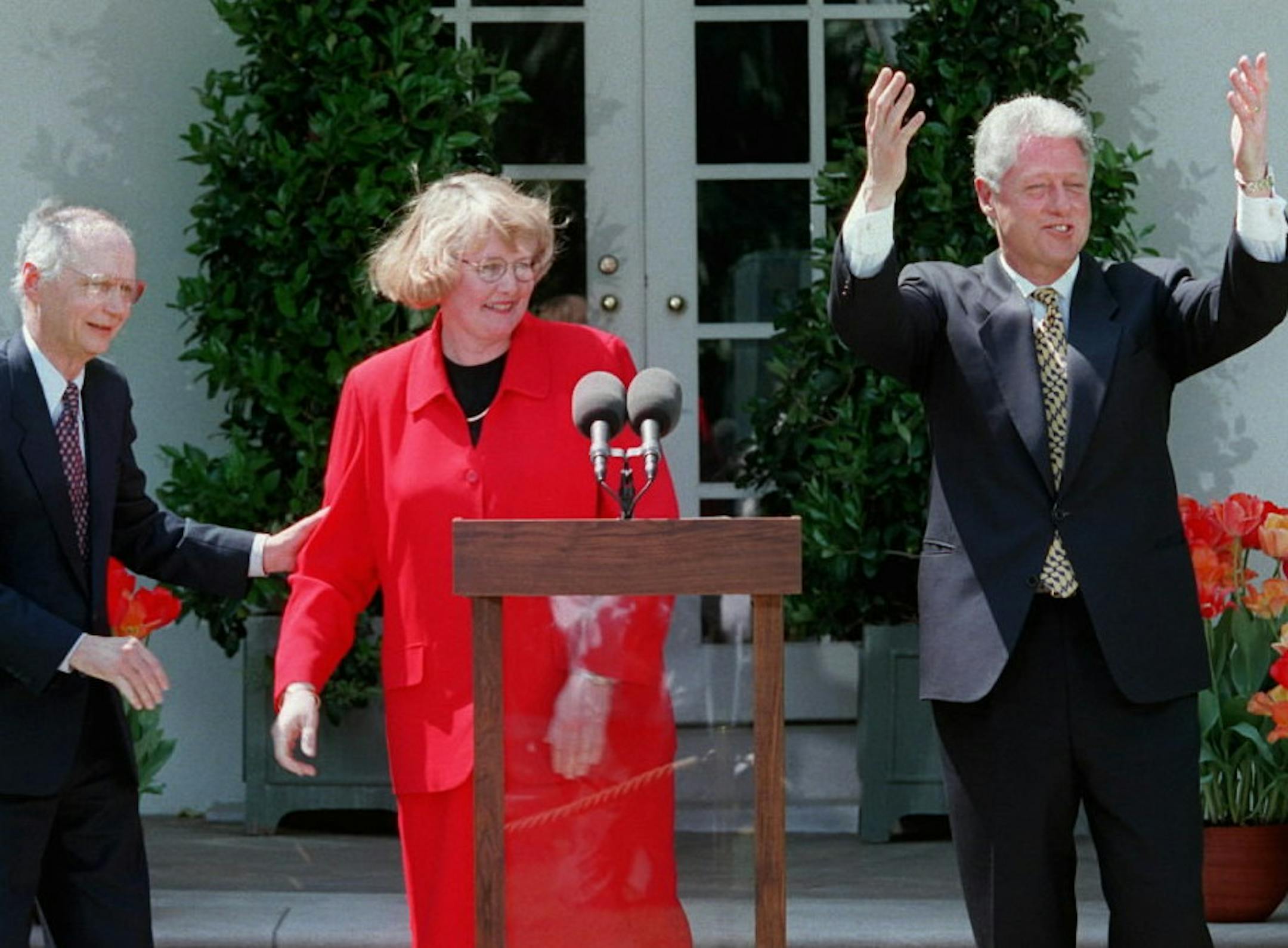 President Clinton, accompanied by Mary Beth Blegen, the National Teacher of the Year, and Education Secretary Richard Riley, gestures in the Rose Garden of the White House Tuesday April 23, 1996 where the president honored the History, Humanities and Writing teacher from Worthington Senior High School in Worthington, Minn. (AP Photo/Ruth Fremson)