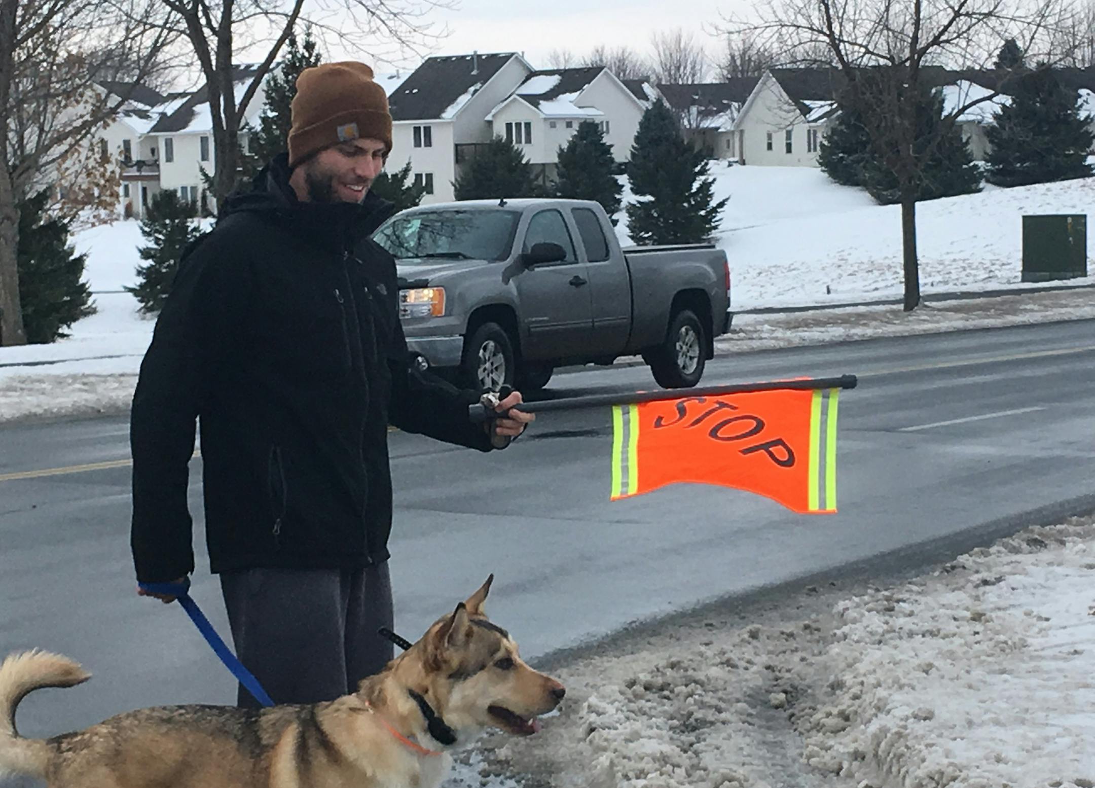 Elliot Wilcox used the new pedestrian flags as he walked his dog across a busy Hastings intersection.