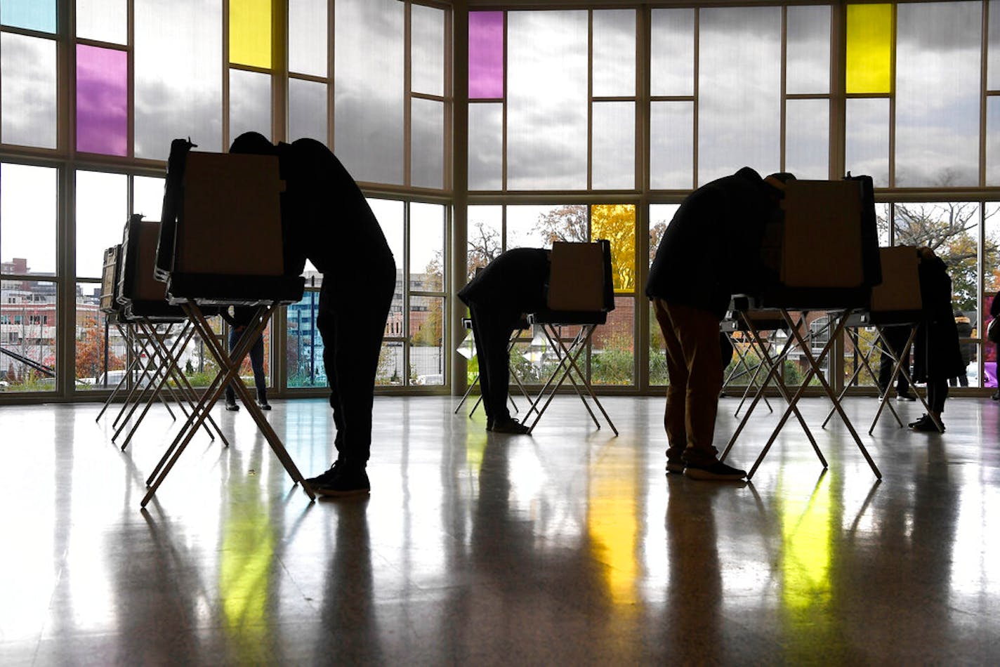 Voters mark their ballots at First Presbyterian Church on Election Day, Tuesday, Nov. 3, 2020, in Stamford, Conn. (AP Photo/Jessica Hill)