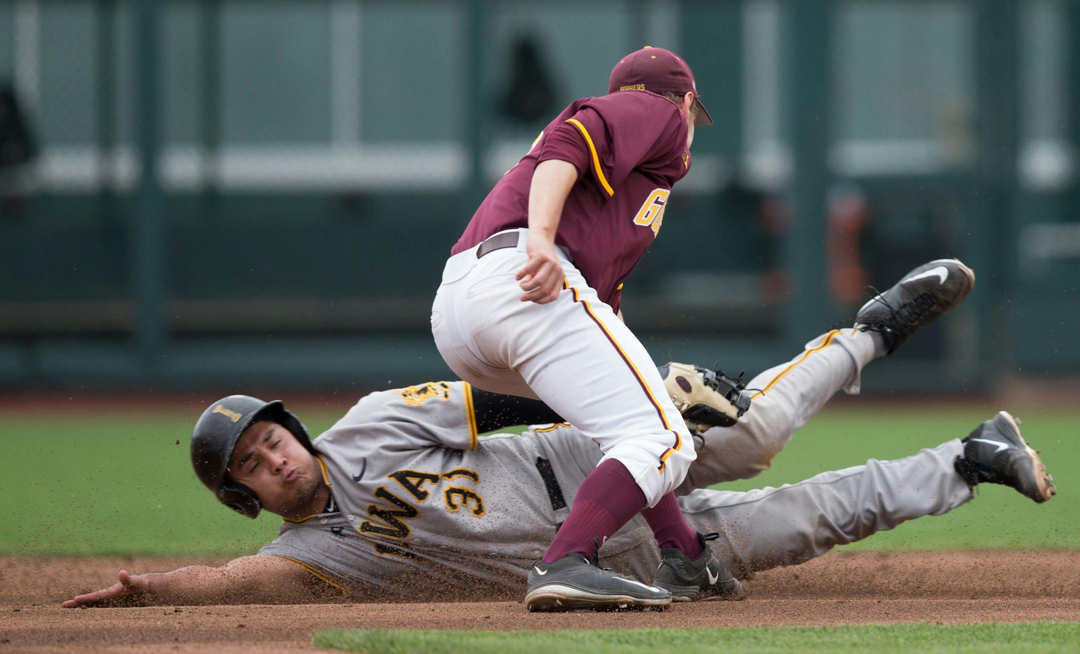 Iowa's Daniel Aaron Moriel is safe at second after beating the tag during a Big Ten tournament game at TD Ameritrade Park on Wednesday, May 25, 2016, in Omaha.