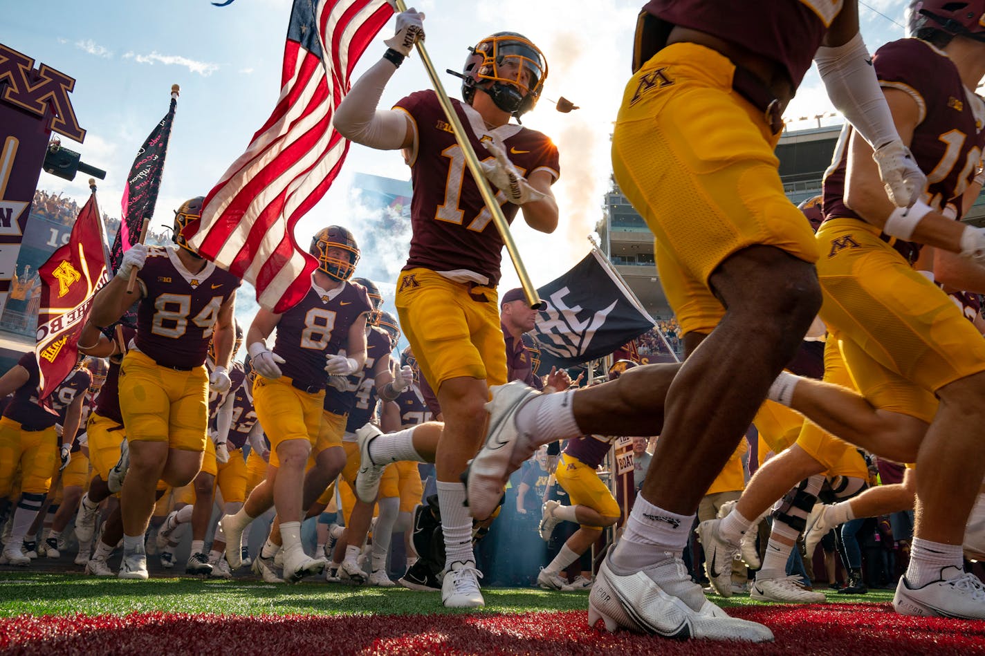 The Minnesota Gophers run onto the field ahead of their game against the Purdue Boilermakers Saturday, Oct. 1, 2022 at Huntington Bank Stadium in Minneapolis, Minn. ]