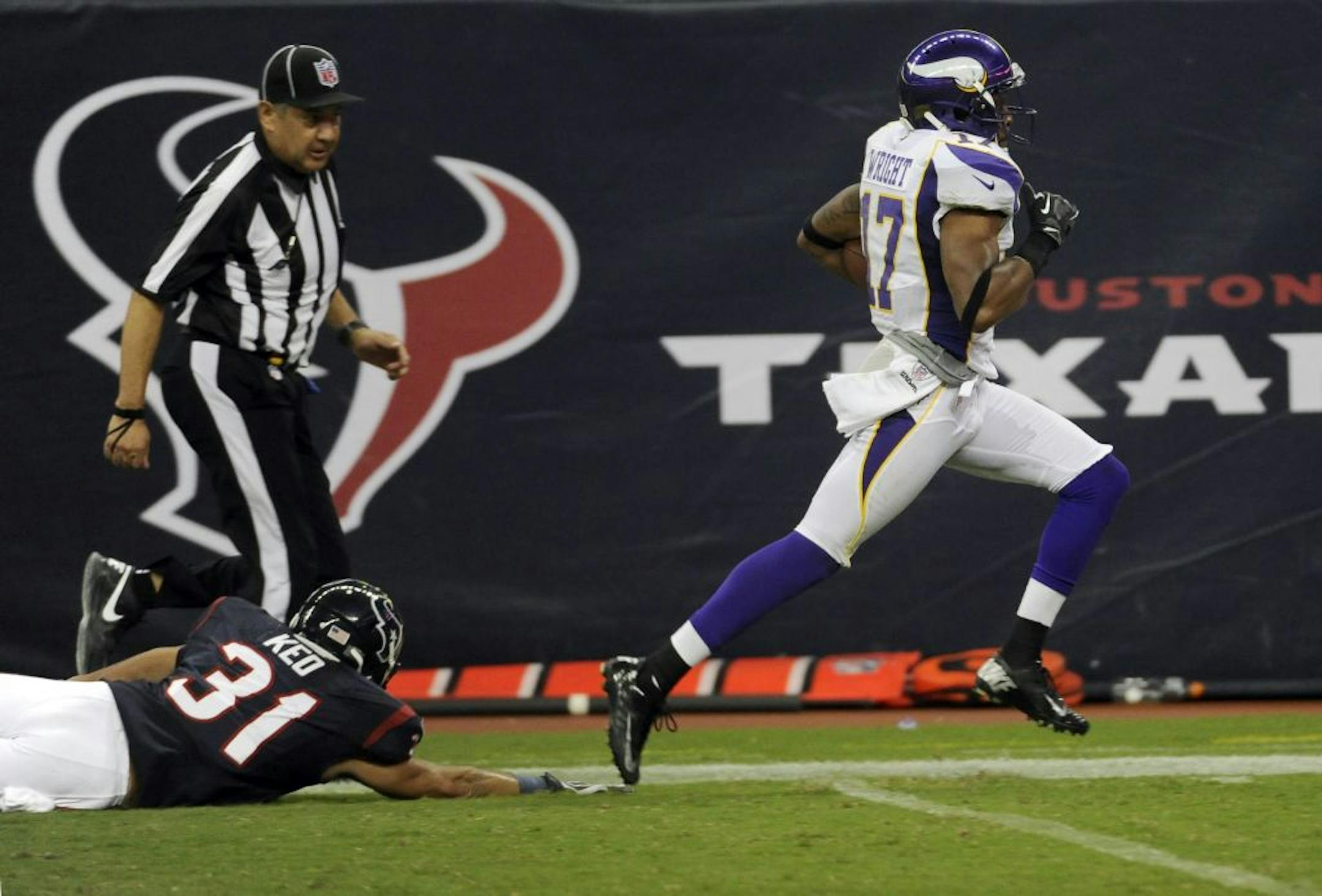 Minnesota Vikings wide receiver Jarius Wright (17) gets past Houston Texans defensive back Shiloh Keo (31) for a 59-yard touchdown reception from quarterback McLeod Bethel-Thompson during the second half of an NFL preseason football game, Thursday, Aug. 30, 2012, in Houston.