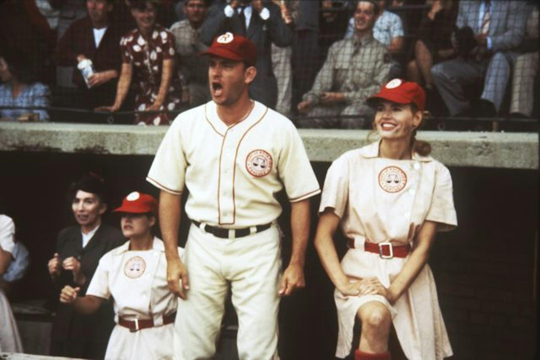 "A League of Their Own"1992 baseball movie from Columbia Pictures. Jimmy Dugan (played by Tom Hanks, center), manager of the Rockford Peaches, and Dottie Hinson (Geena Davis, right), his catcher and top player, root for their team. Handout photo.