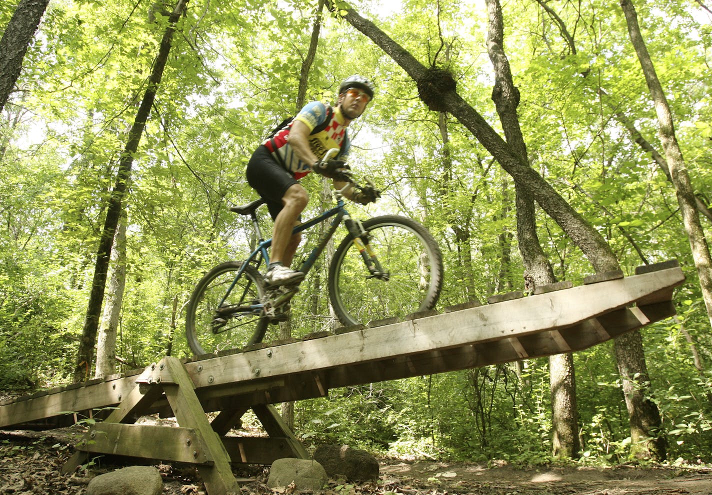 Courtesy of Dakota County Lebanon Hills has become a mecca for mountain bikers as a result of a collaboration between a mountain bike organization and the county. The county had the land and the bike group built trails on it and maintains them. Now since the county opened a restroom and parking lot at the trail head women and families have joined the typically male group of bikers.