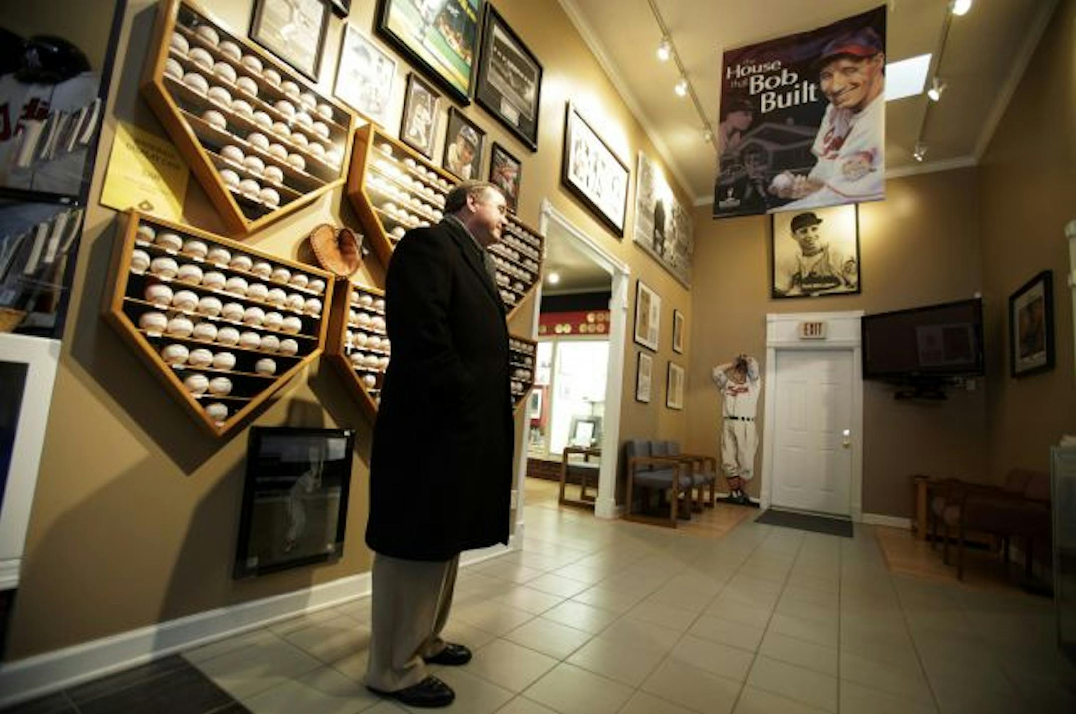 Ed Brown, of West Des Moines, Iowa, looks at a display in the Bob Feller Museum, Thursday, Dec. 16, 2010, in Van Meter, Iowa. Feller, a Hall of Fame pitcher who won 266 games in 18 seasons with the Cleveland Indians, died on Wednesday of acute leukemia at a hospice.