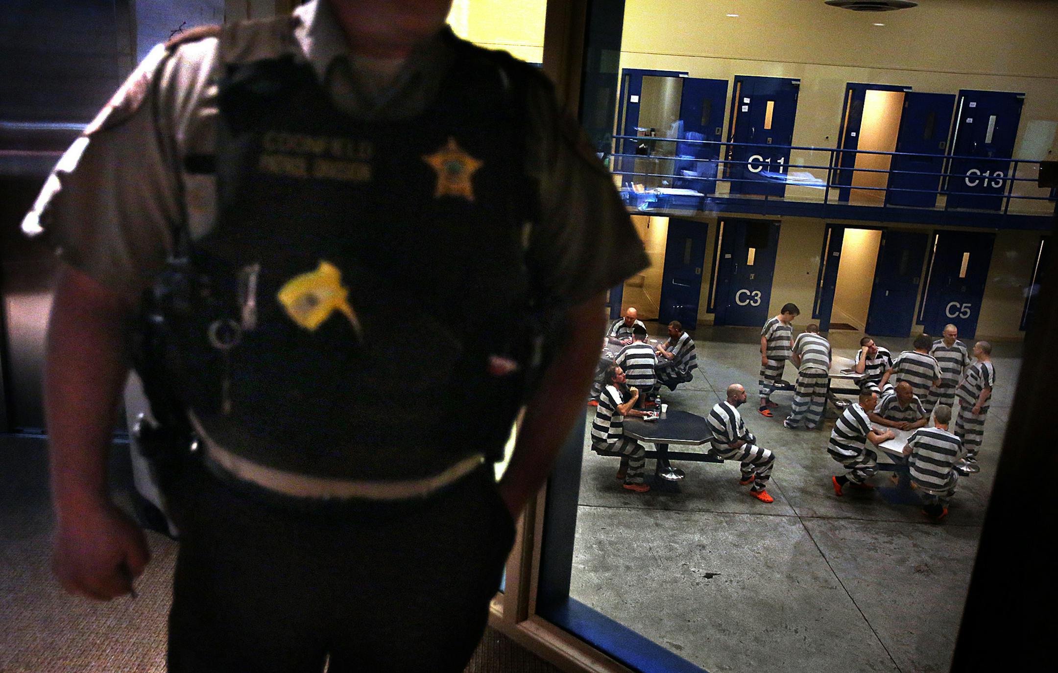 Williams County sheriff‚Äôs deputy Bruce Coonfield stood in a control room overlooking an open area at the Williams County Jail in Williston. The jail used to house an average of about 20 inmates a night before the oil boom took off in 2008. The jail now accommodates more than 115 prisoners a night on average.] (JIM GEHRZ/STAR TRIBUNE) / December 10, 2013, Williston/Napoleon, ND ‚Äì BACKGROUND INFORMATION- PHOTOS FOR USE IN FIFTH PART OF NORTH DAKOTA OIL BOOM PR