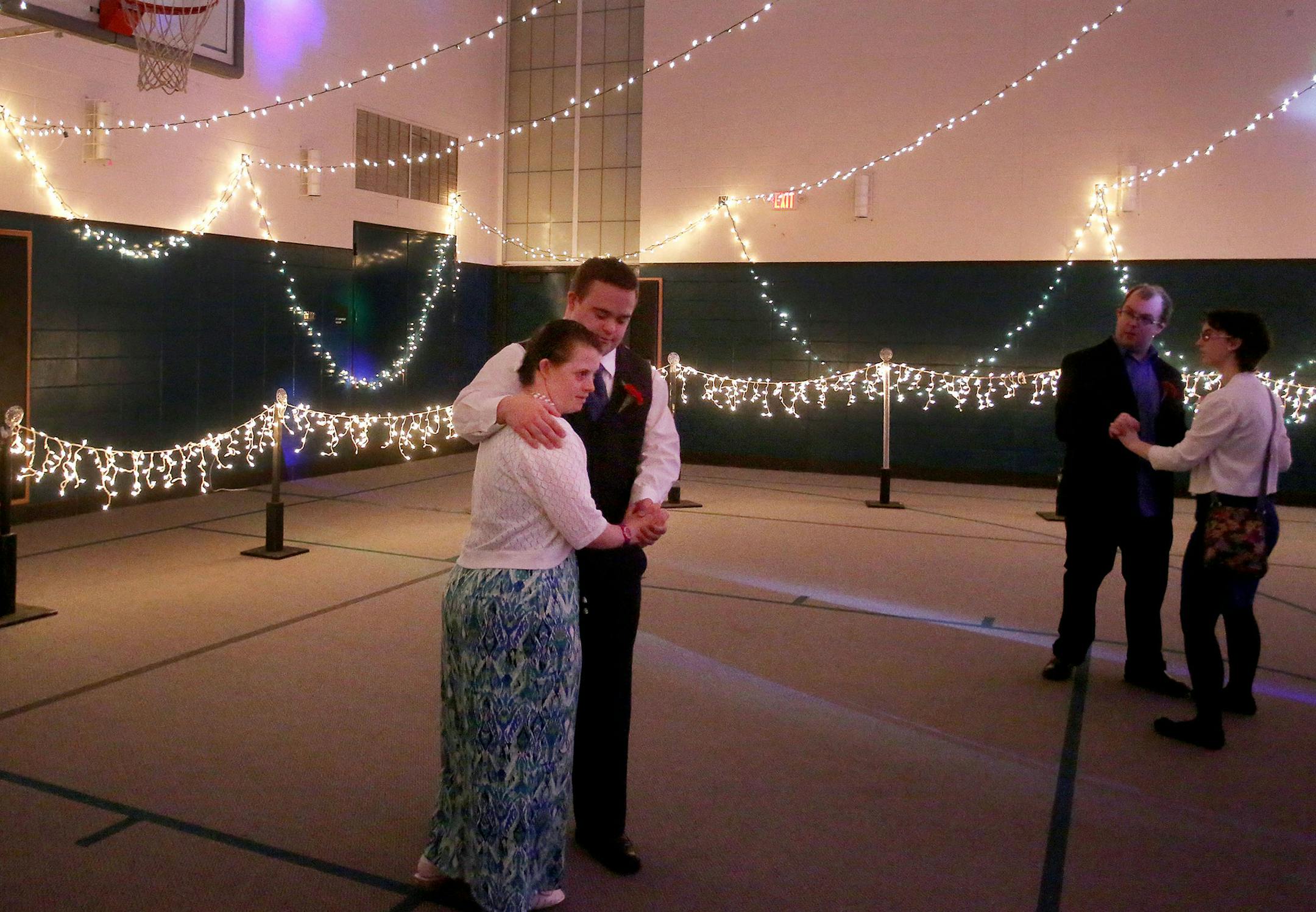 Kyle Burtman holds his date Kaela Bartlett close during the Snowflake Ball Saturday, Feb. 20, 2016, at Ridgewood Church in Minnetonka.](DAVID JOLES/STARTRIBUNE)djoles@startribune.com The Snowflake Ball, a semi-formal dance especially for individuals with disabilities ages high school through adult, will take place at Ridgewood Church in Minnetonka.**Kyle Burtman,Kaela Bartlett, cq ORG XMIT: MIN1602202053071003