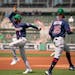Minnesota Twins shortstop Nick Gordon and center fielder Byron Buxton warmed up before their game against the Red Sox at jetBlue Park in Fort Myers, F