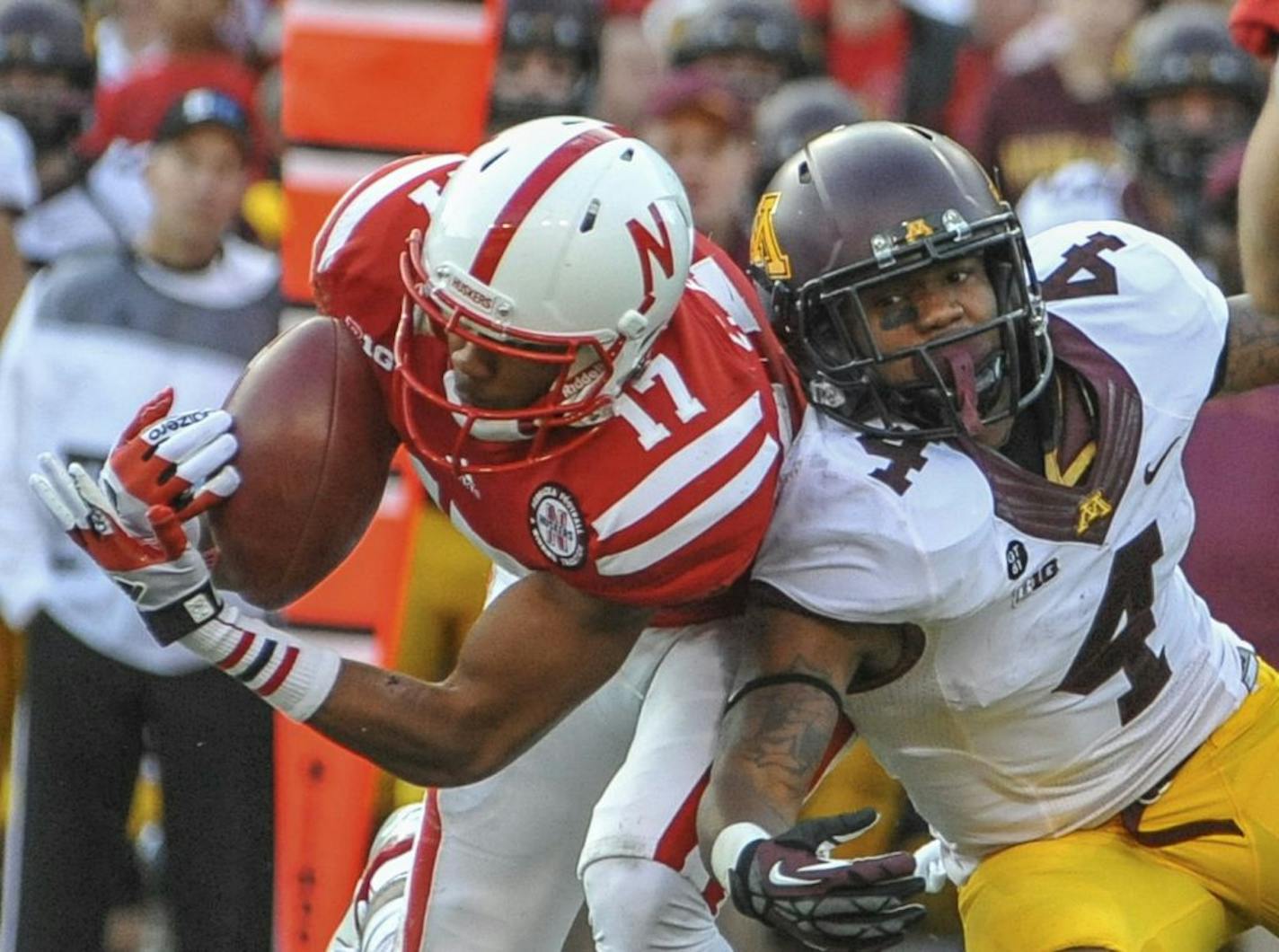 Nebraska's Ciante Evans nearly intercepts a pass intended for Minnesota's KJ Maye