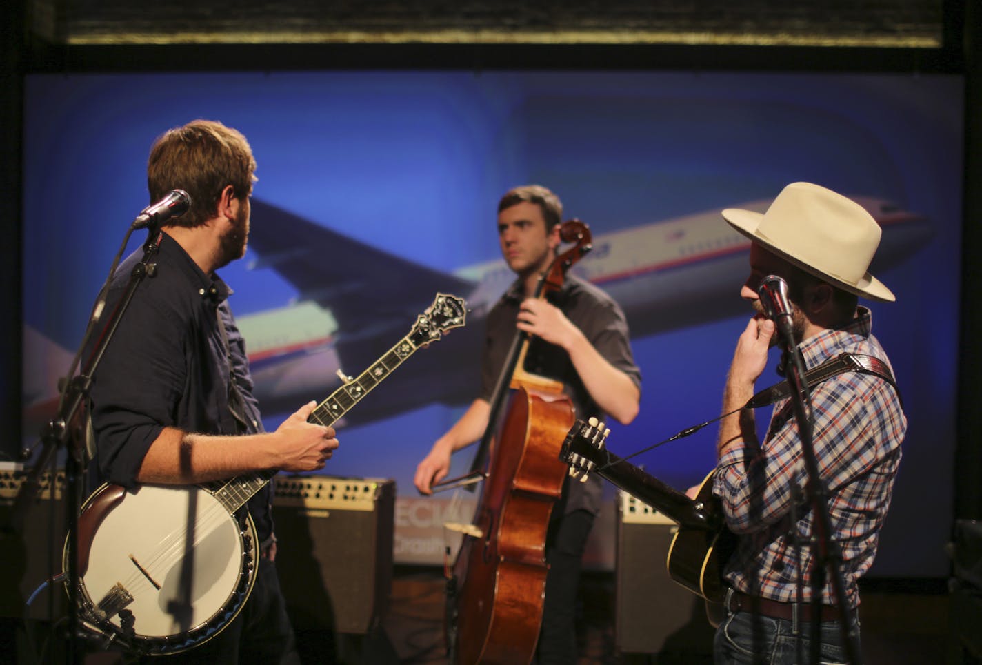 Dave Carroll, Eamonn McLain, and Dave Simonett, from left, began their sound check at a CBS television studio in Manhattan as the story of a downed Ukrainian airliner unfolded around them. They ultimately had to postpone the taping and hit the road for a gig in Rochester, NY that night. ] JEFF WHEELER &#x2022; jeff.wheeler@startribune.com Trampled By Turtles were about to record a segment for the CBS Morning Show when the downing of a passenger plane in Ukraine forced a cancellation on Thursday