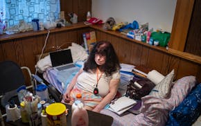 Sherry Rae Linn sits in her room at an assisted living home in Brooklyn Park on Thursday. Linn is trying to get free from her court-appointed guardian
