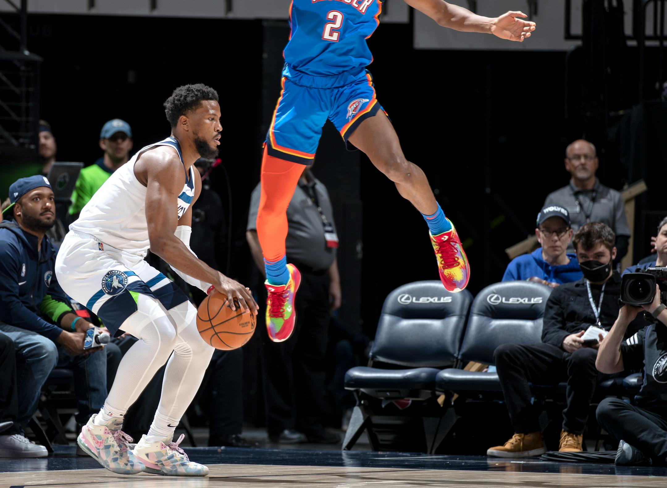 Malik Beasley (5) of the Minnesota sets up for a three point shot in the third quarter while defended by Shai Gilgeous Alexander (2) of the Oklahoma City Thunder.