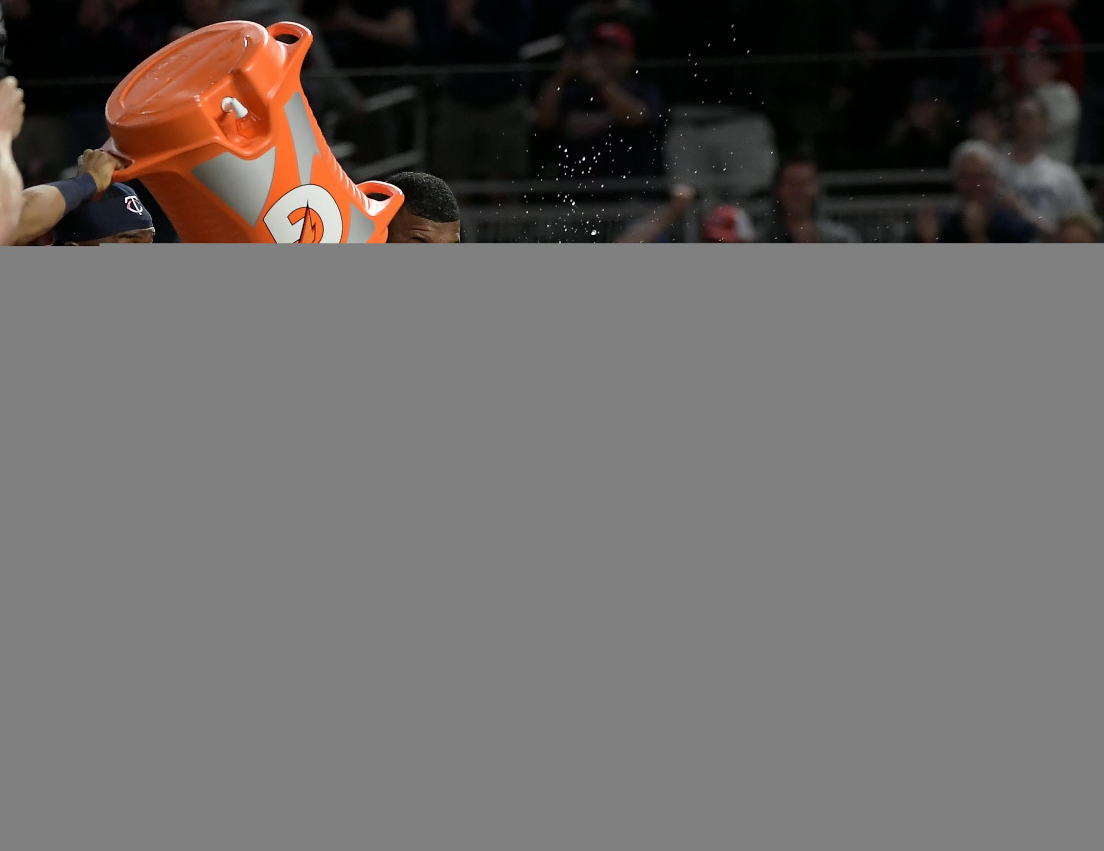 Teammates celebrated with Twins first baseman Joe Mauer (7) after he hit a walk off homerun against the Boston Red Sox.